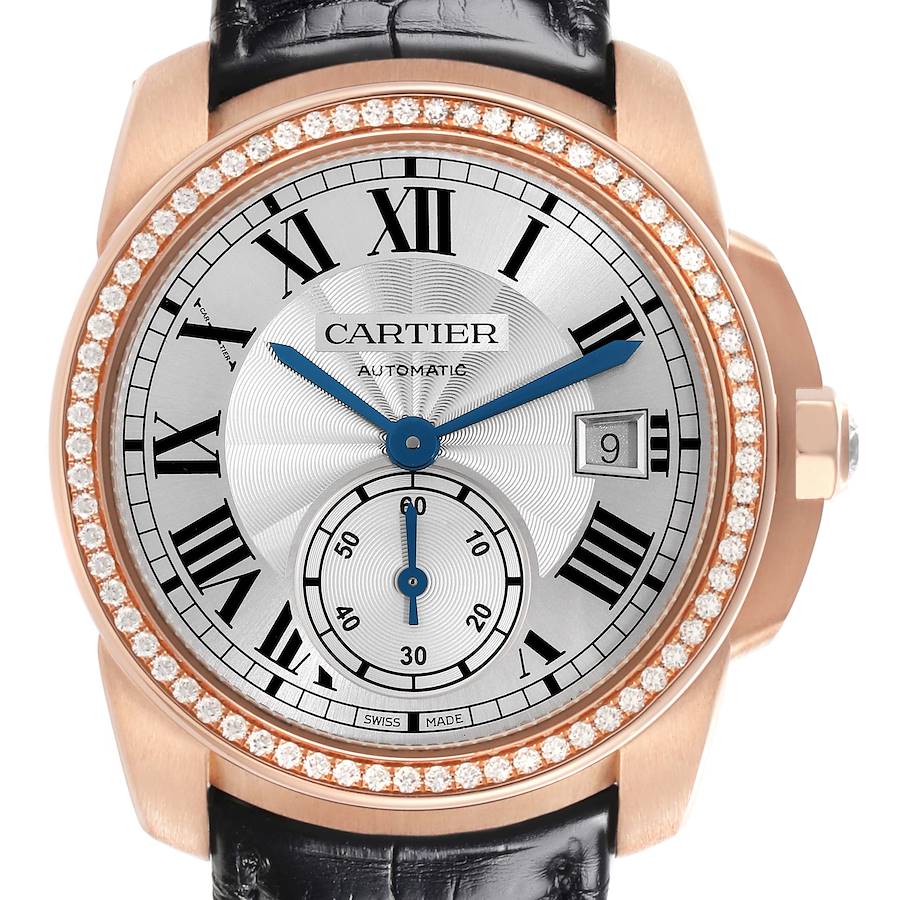 The Calibre de Cartier watch is shown from a front angle highlighting the dial, bezel, and crown.