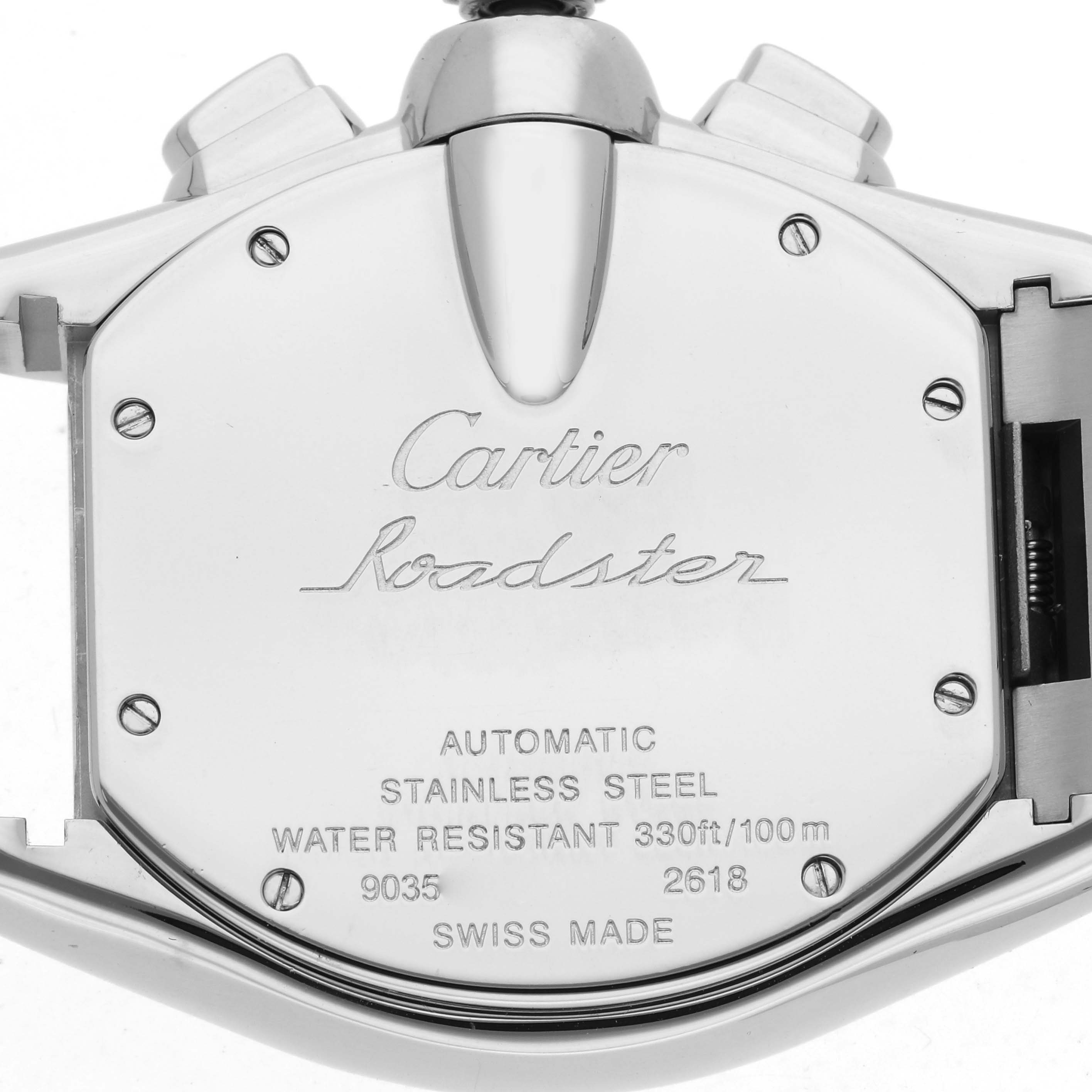 The image shows the back case of a Cartier Roadster W62019X6 Men's Stainless Steel Silver Dial watch, highlighting its markings and specifications.