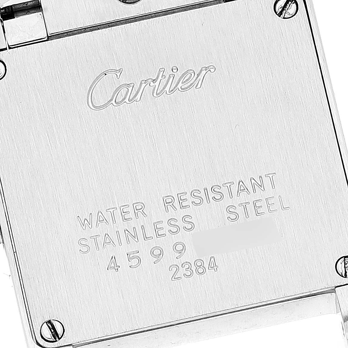 This image shows the back case of a Cartier Tank Francaise W51007Q4 Women's Steel and Gold (two tone) Silver Dial W51007Q4 Women's Steel and Gold (two tone) Silver Dial watch, highlighting the engraved brand, model number, and specifications.