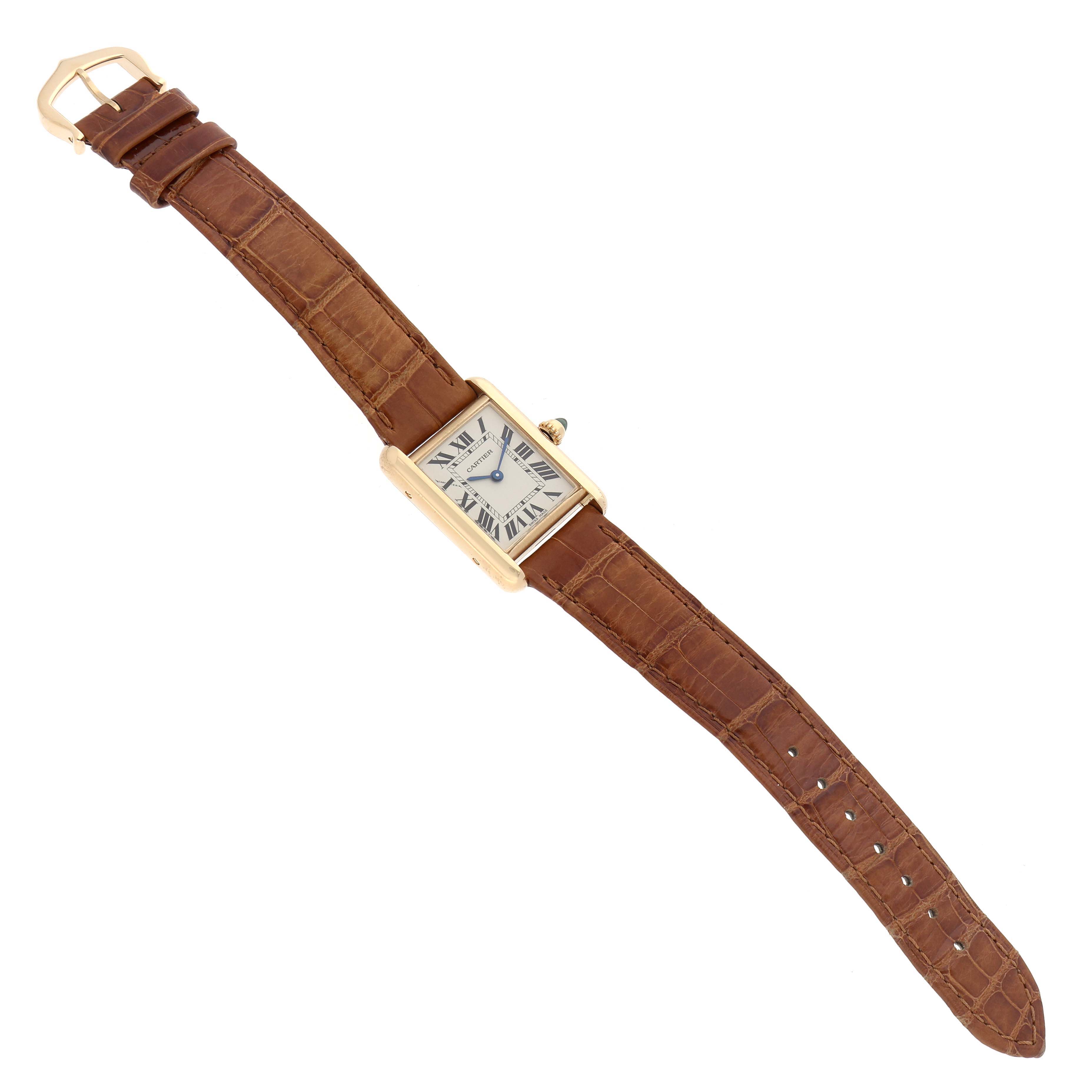 The Cartier Tank Louis W1529856 Women's Yellow Gold Silver Dial watch is shown from an angled top view, displaying the entire face, strap, and buckle.