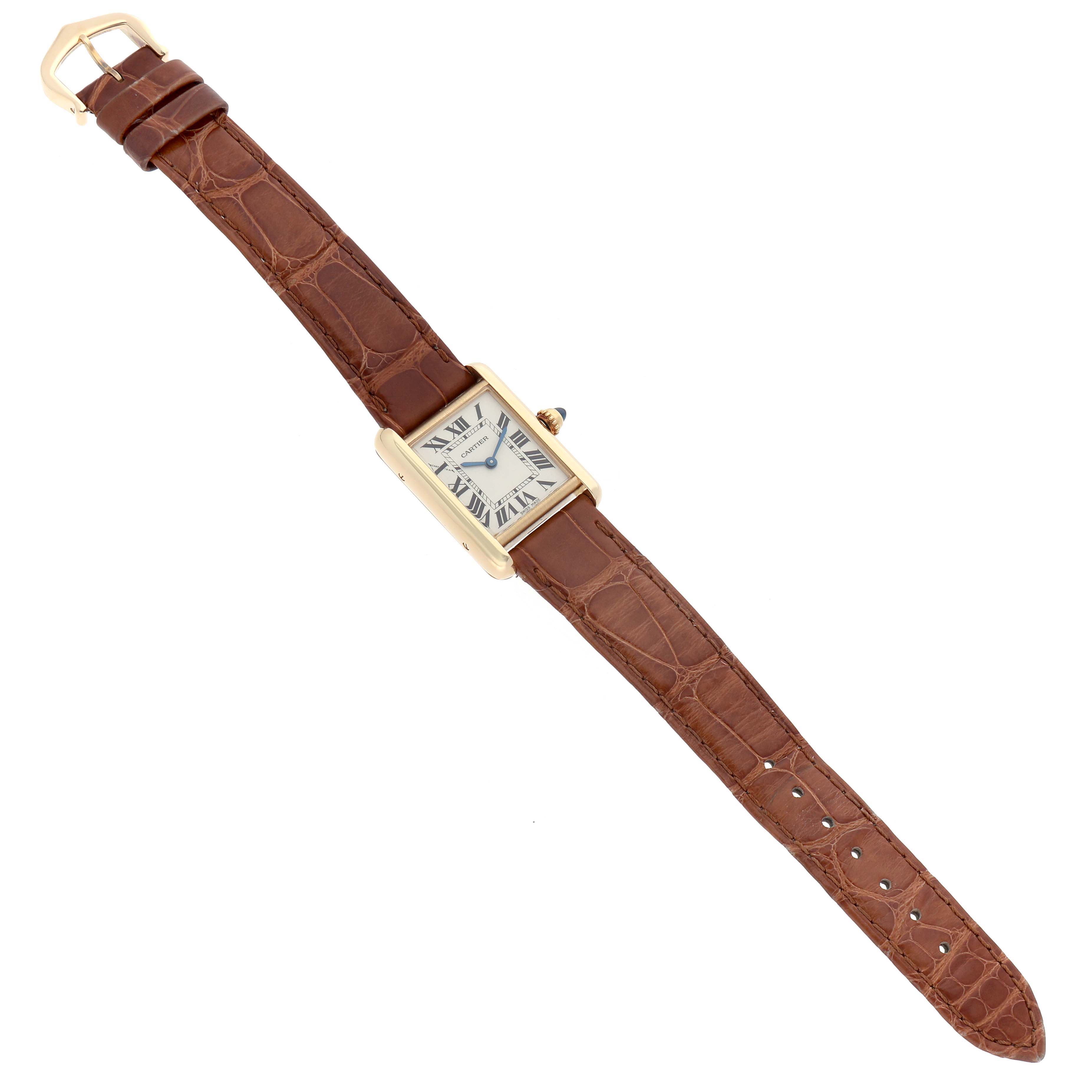 The Cartier Tank Louis W1529856 Women's Yellow Gold Silver Dial watch is shown from a top-down angle, showcasing its brown leather strap and rectangular face.
