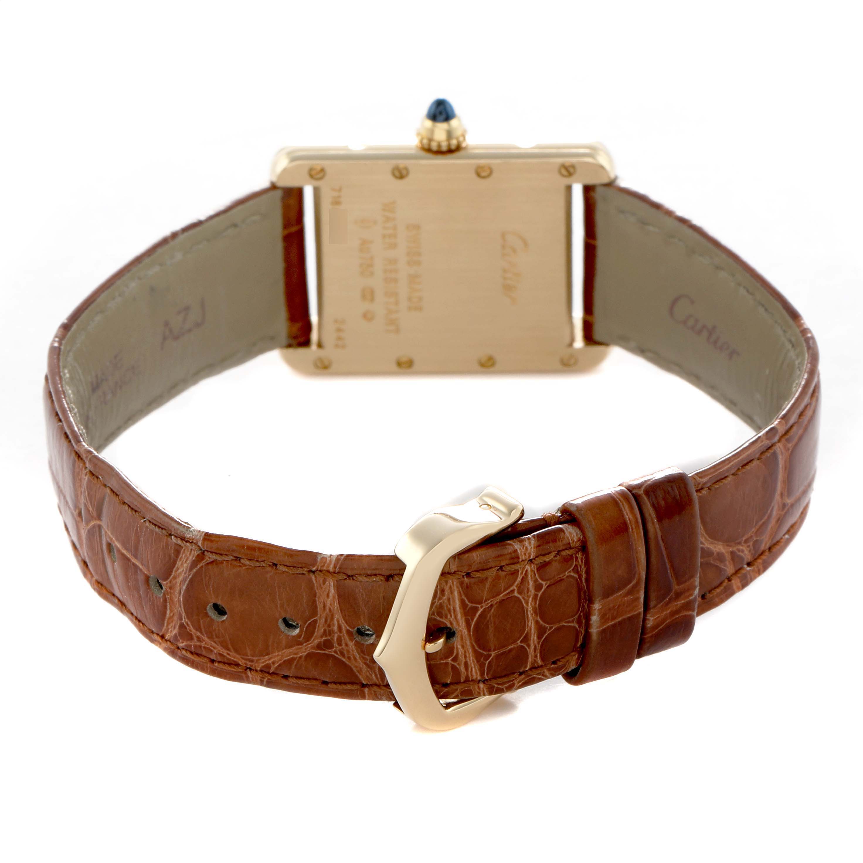 The Cartier Tank Louis W1529856 Women's Yellow Gold Silver Dial watch is shown from the back, highlighting the case back, strap, and buckle.