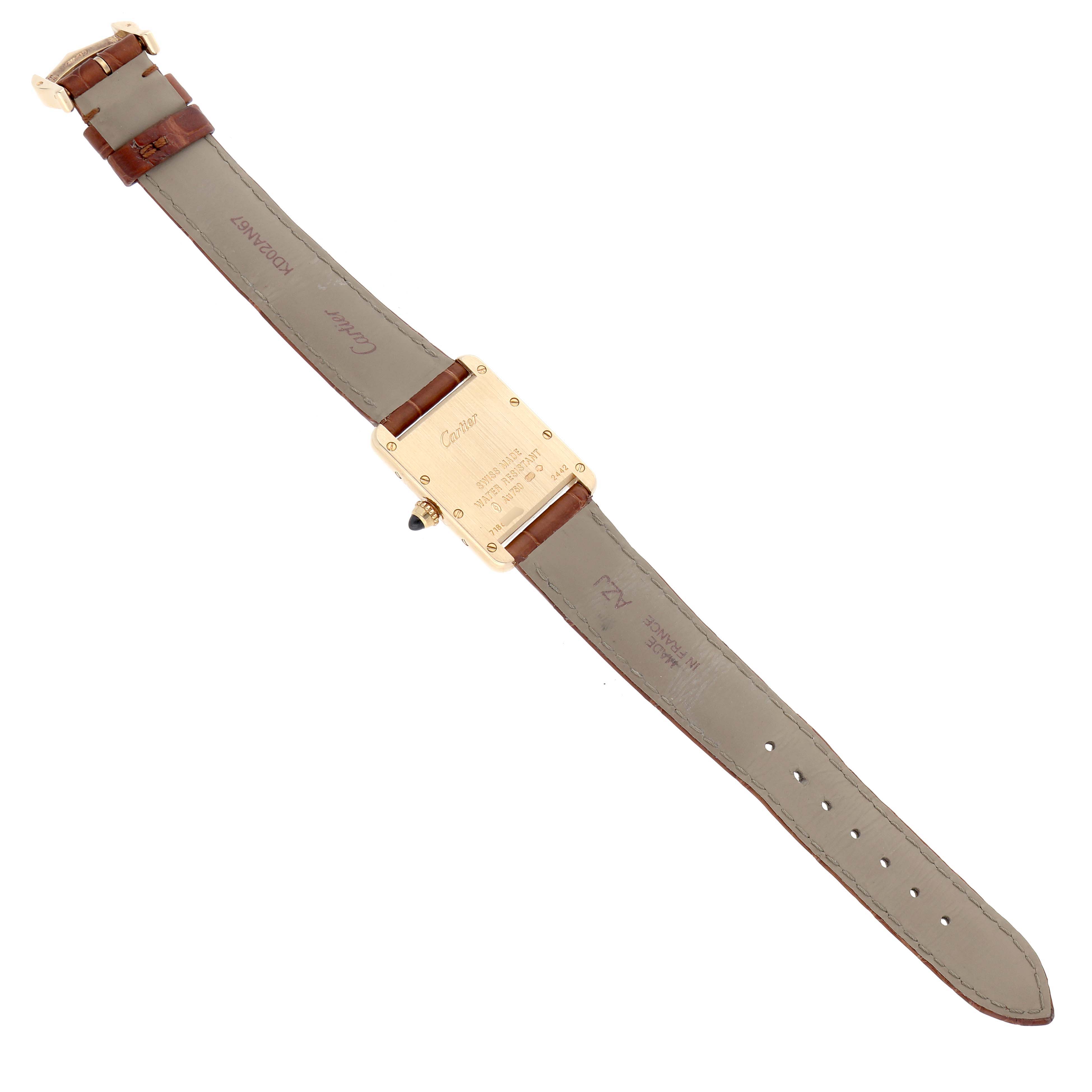 The image shows the back and strap of a Cartier Tank Louis W1529856 Women's Yellow Gold Silver Dial, highlighting the case back and leather strap.