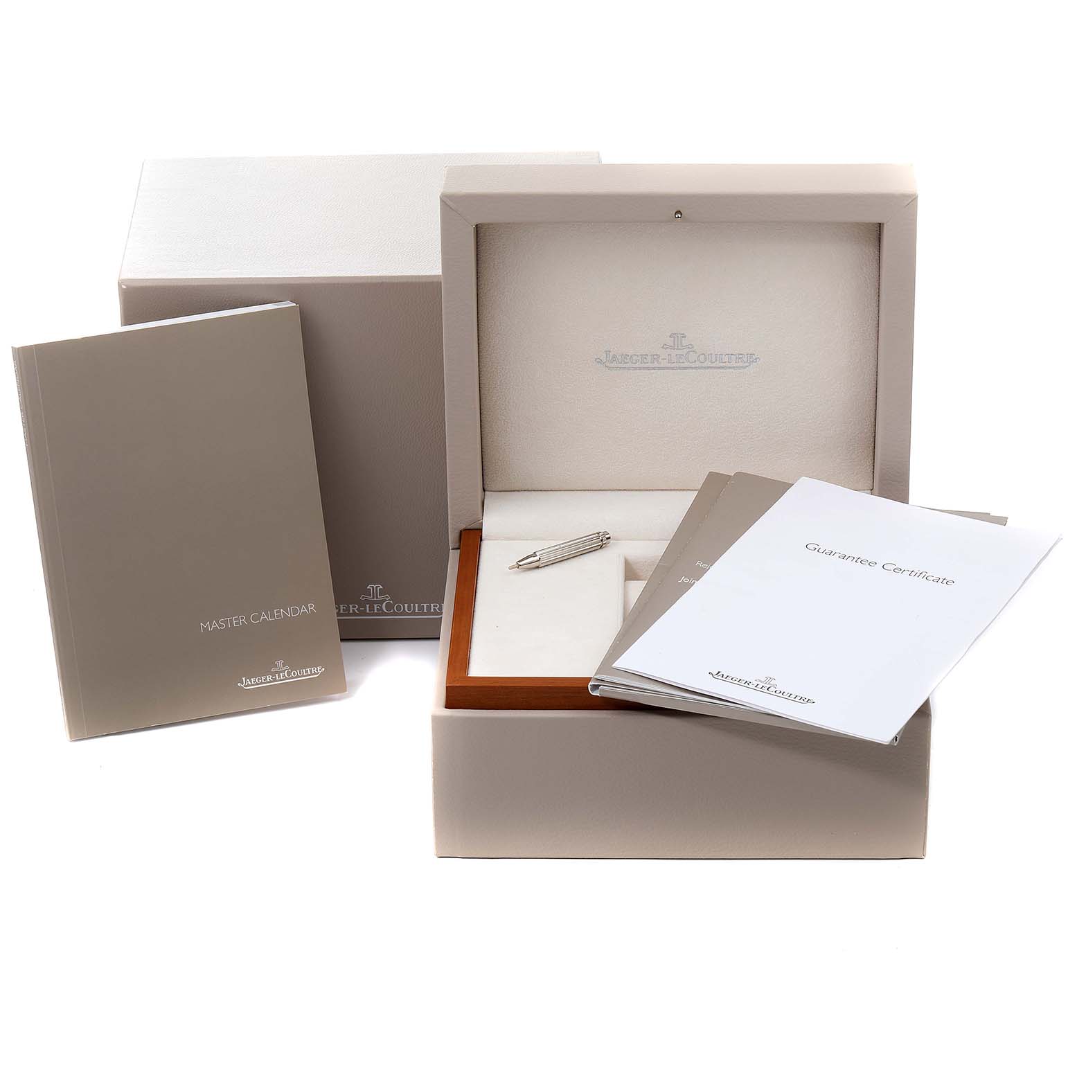 The image shows a Jaeger LeCoultre Master 147.8.41.S Men's Stainless Steel Silver Dial 147.8.41.S Men's Stainless Steel Silver Dial model watch box, along with booklets and a tool, viewed from the front.