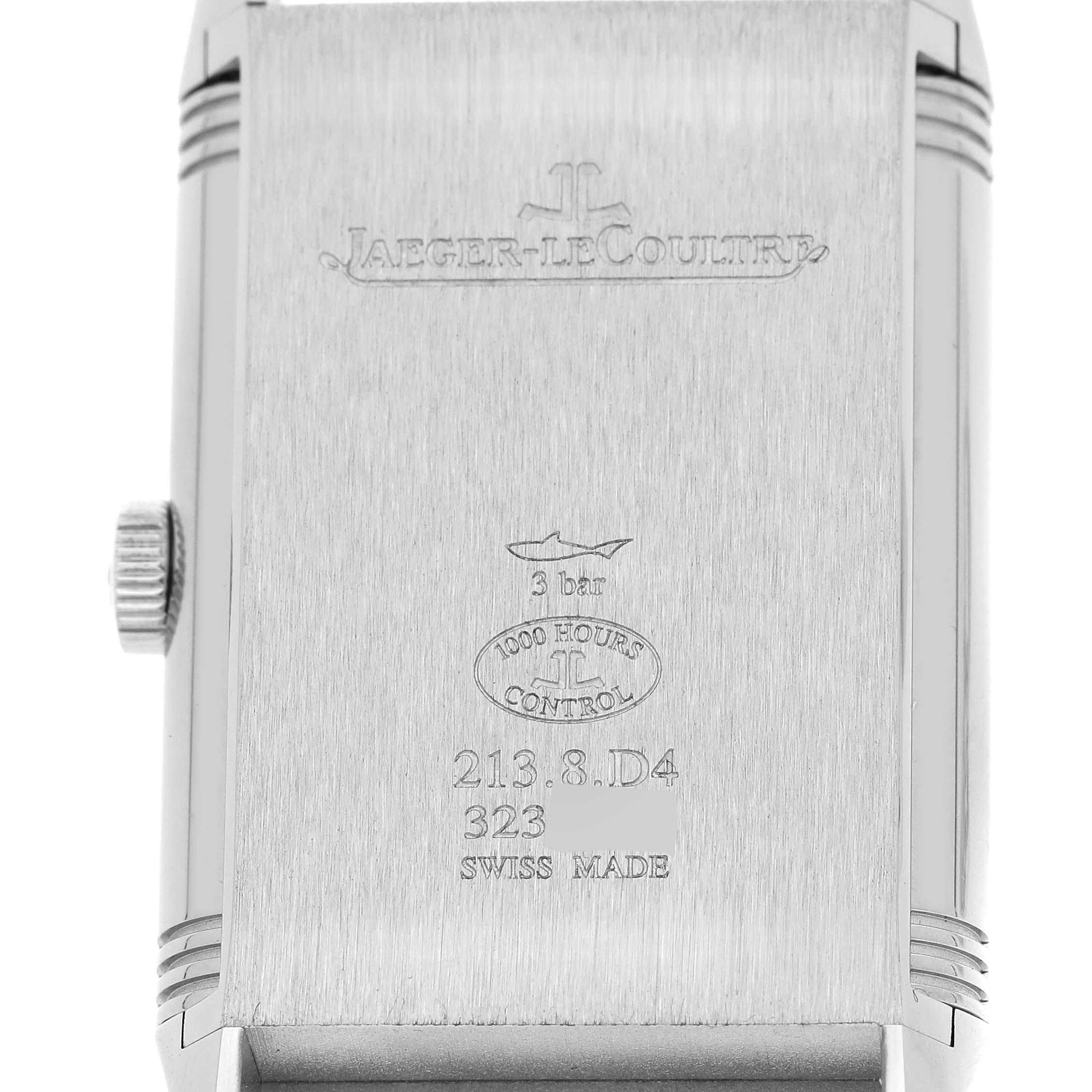 This image shows the back case of a Jaeger-LeCoultre Reverso watch, highlighting engravings and details.