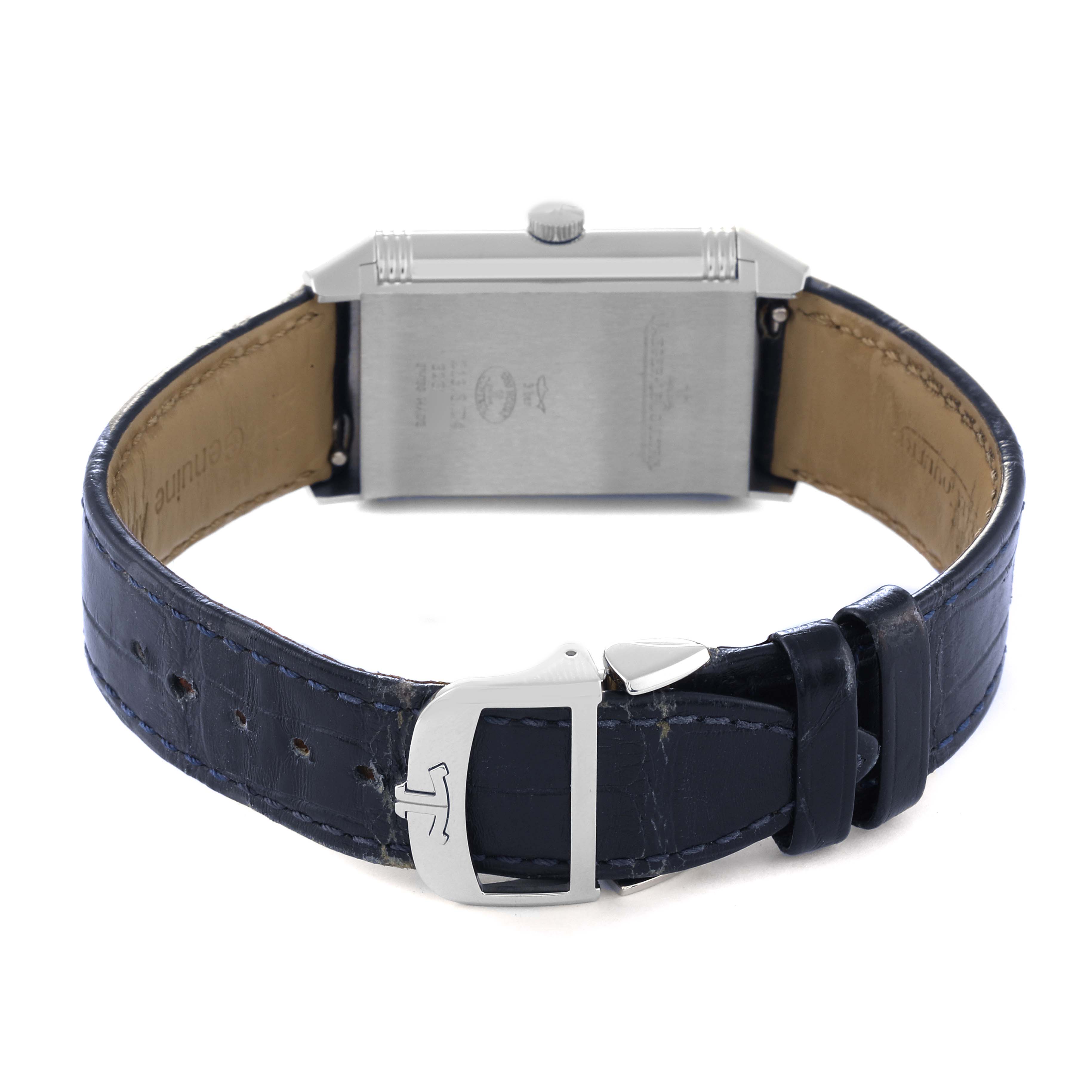 The image shows the back of the Jaeger-LeCoultre Reverso watch, highlighting the case back, leather strap, and clasp.