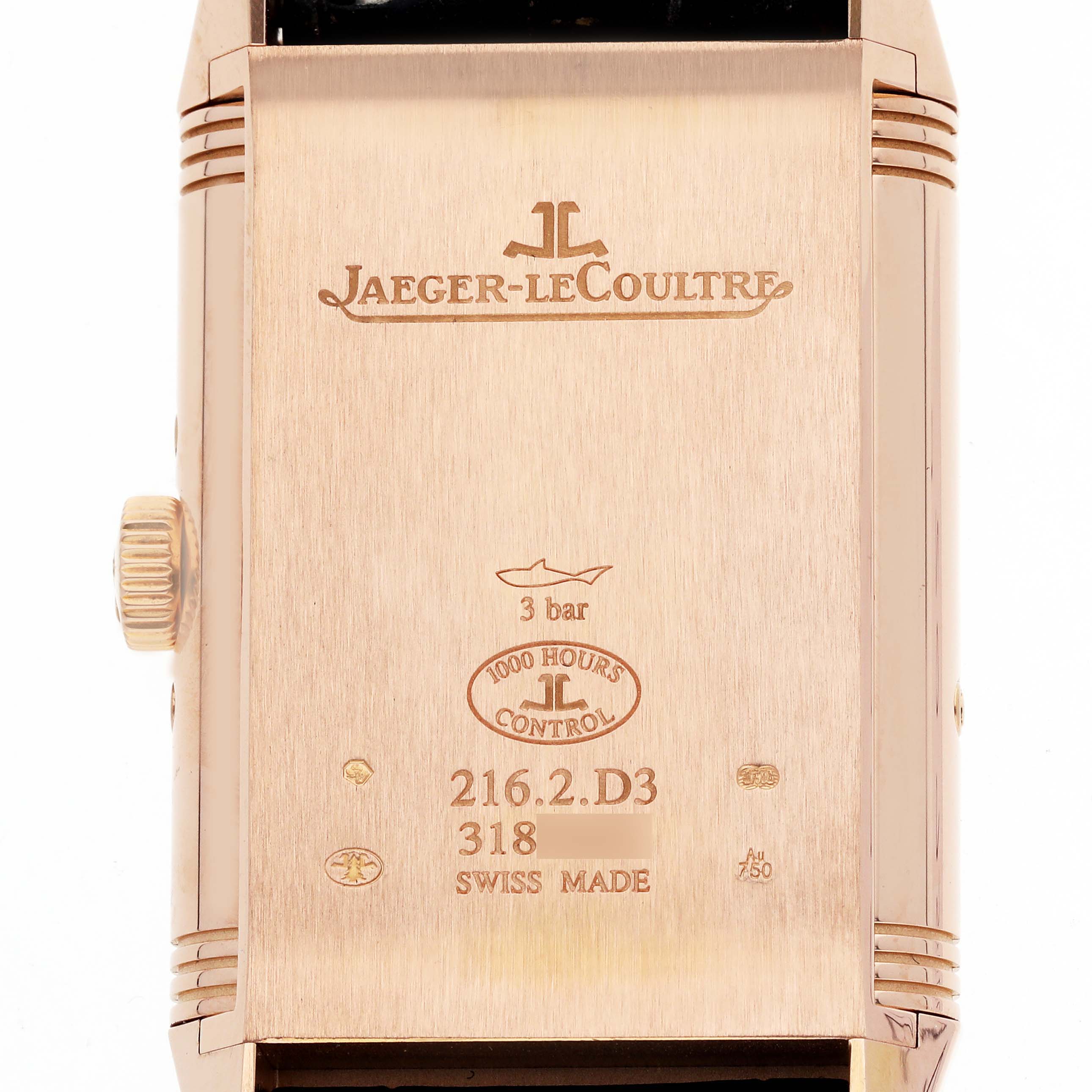 The image shows the back of a Jaeger-LeCoultre Reverso watch, displaying the brand, model details, and water resistance rating.