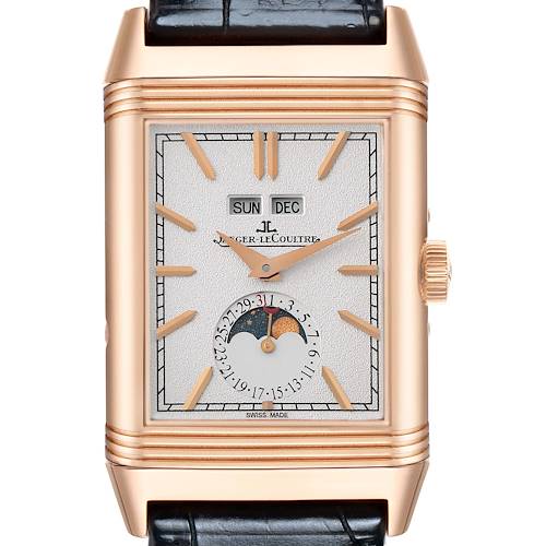 The Jaeger-LeCoultre Reverso watch is shown from the front, displaying its rectangular face, hands, date, day, and month indicators.