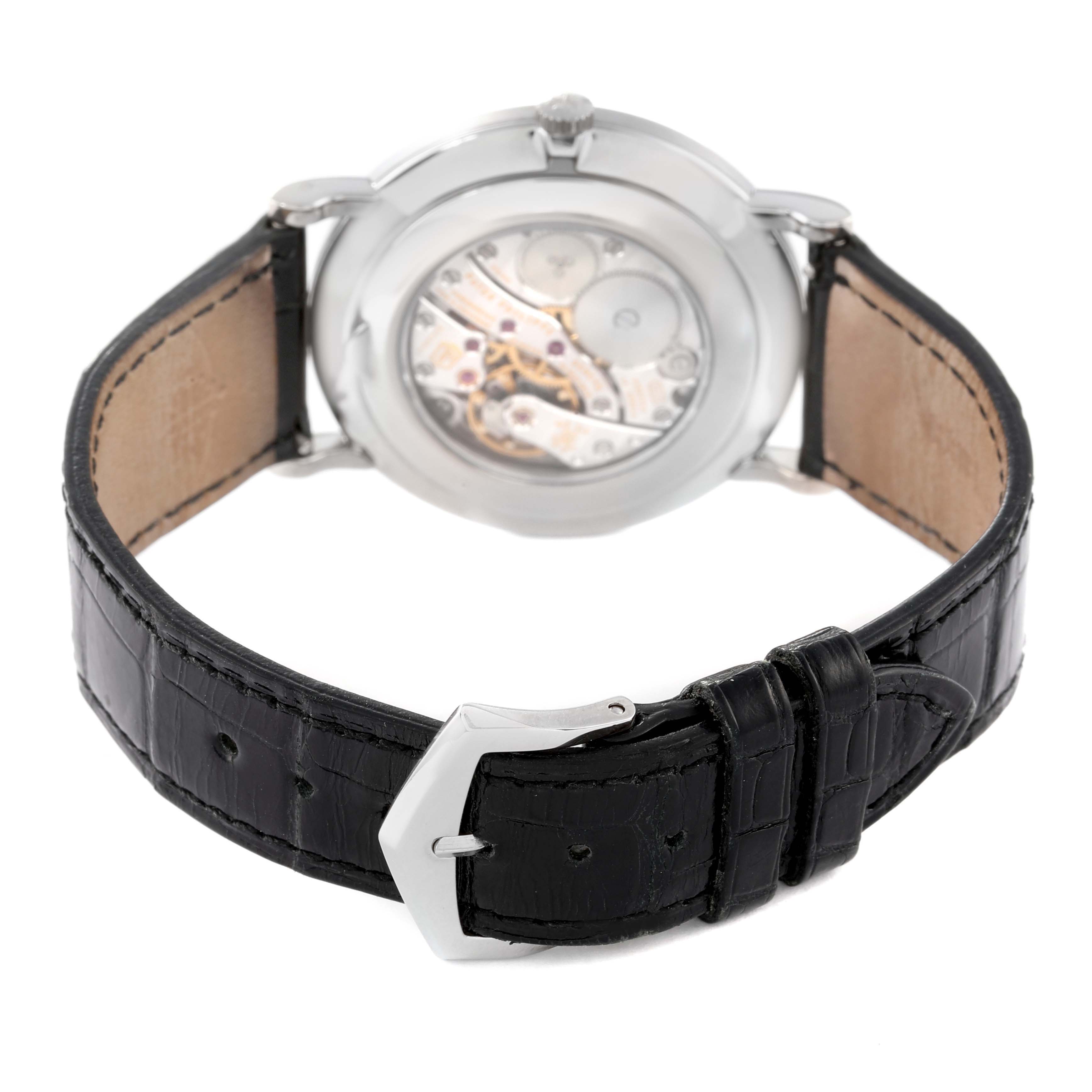 The image shows the back view of a Patek Philippe Calatrava 5119G Men's White Gold White Dial 5119G Men's White Gold White Dial, displaying its polished caseback and alligator leather strap.