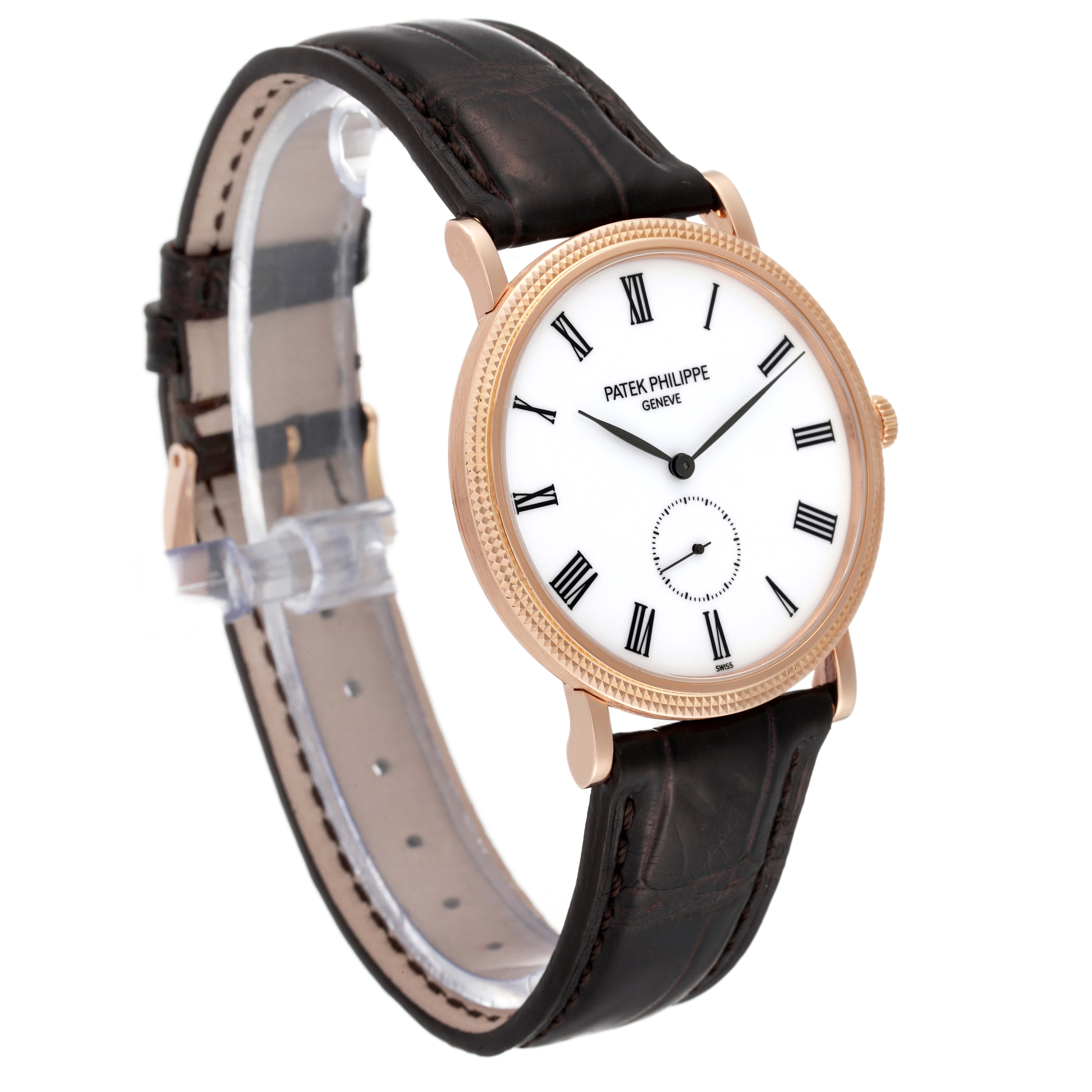 The Patek Philippe Calatrava 5119R Men
s Rose Gold White Dial 5119R Men
s Rose Gold White Dial watch is shown at a three-quarter angle, highlighting its face, leather strap, and clasp.