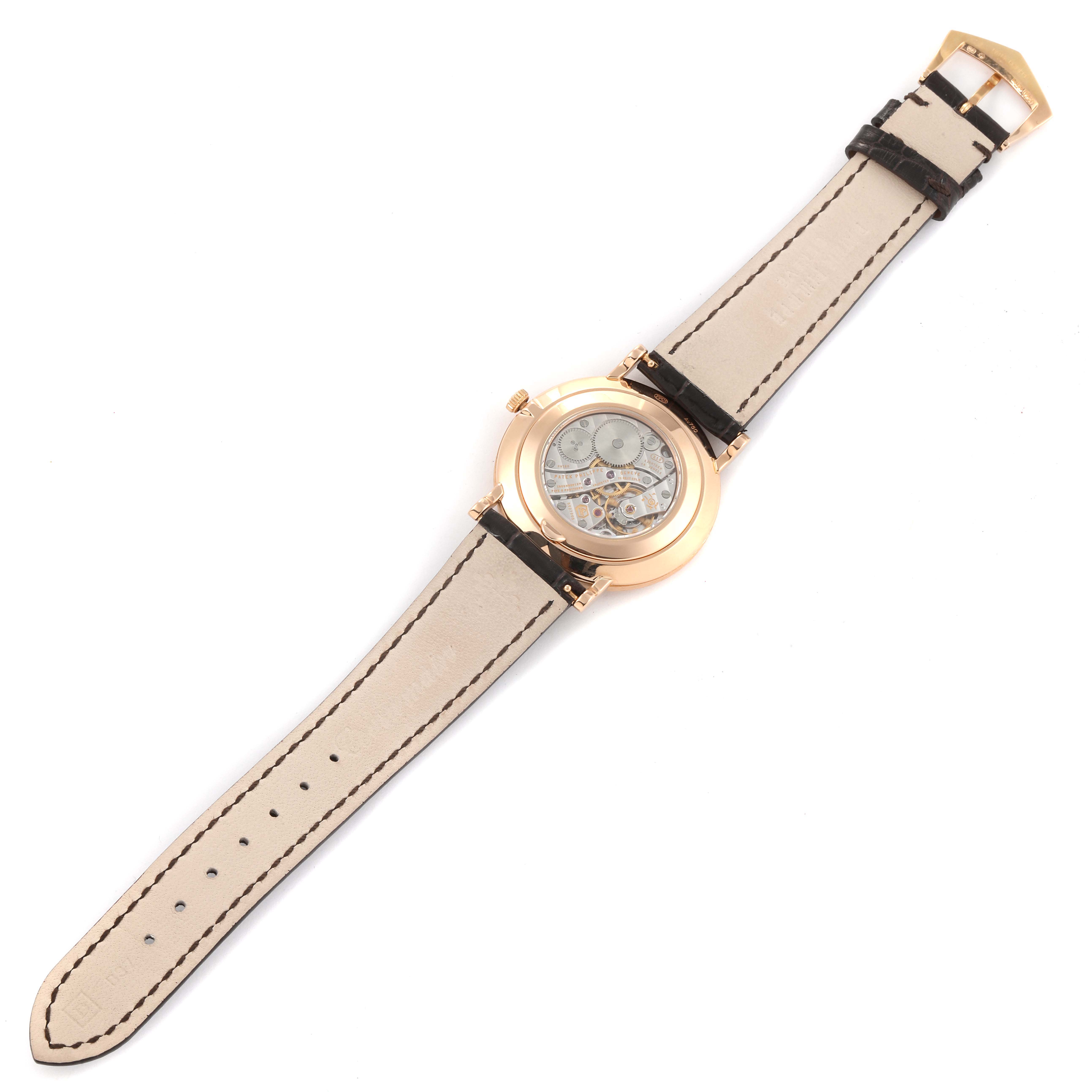 This image shows the back view of the Patek Philippe Calatrava 5119R Men
s Rose Gold White Dial 5119R Men
s Rose Gold White Dial watch, highlighting its movement and leather strap.