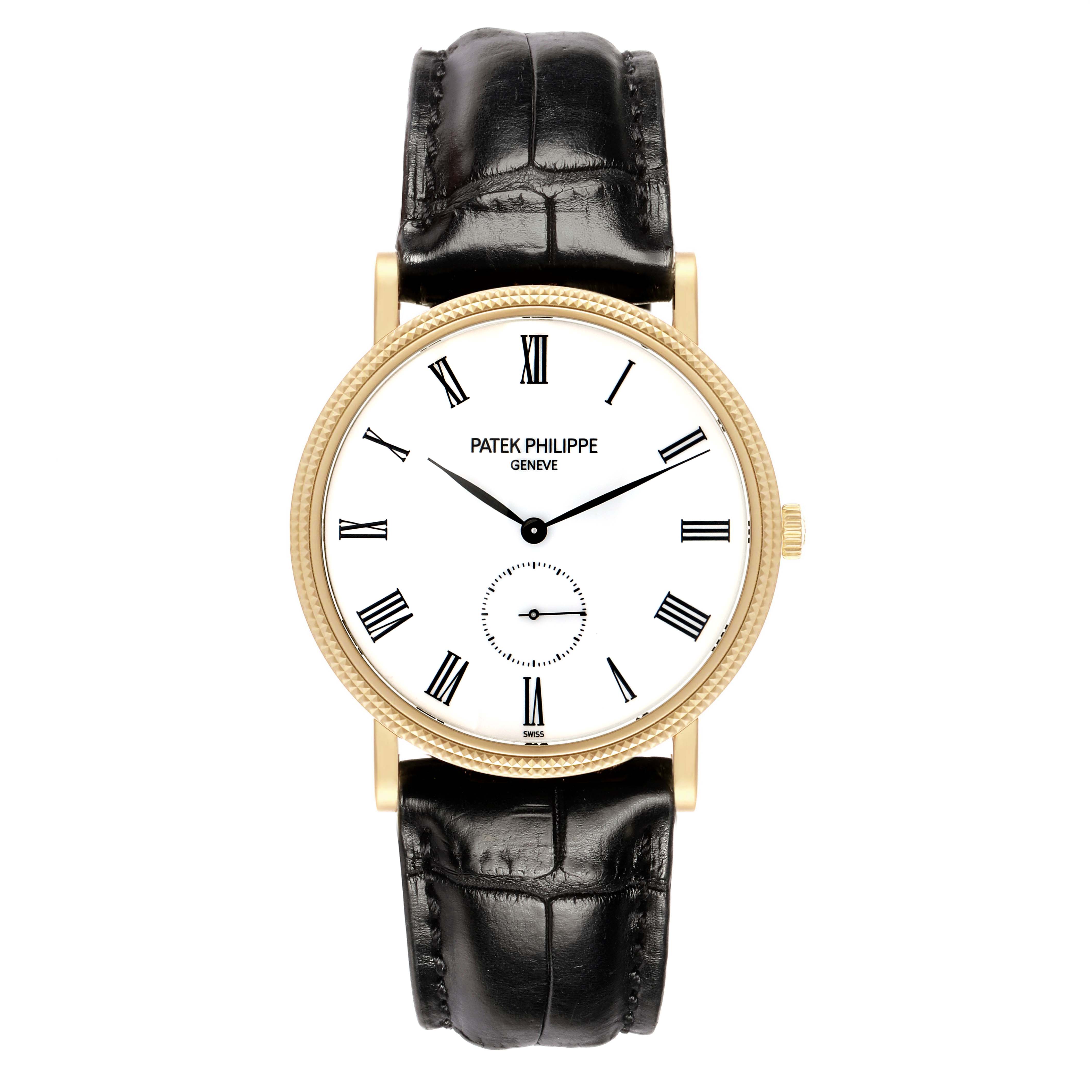 The Patek Philippe Calatrava 5119J Men's Yellow Gold White Dial watch is shown from a top-down angle, highlighting its face, Roman numerals, case, and black leather strap.