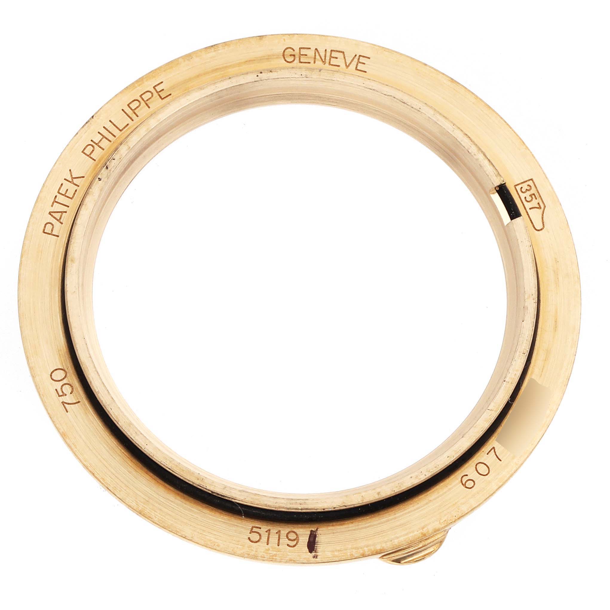 The image shows the case or bezel of a Patek Philippe Calatrava 5119J Men's Yellow Gold White Dial model from a top-down view, highlighting engravings.