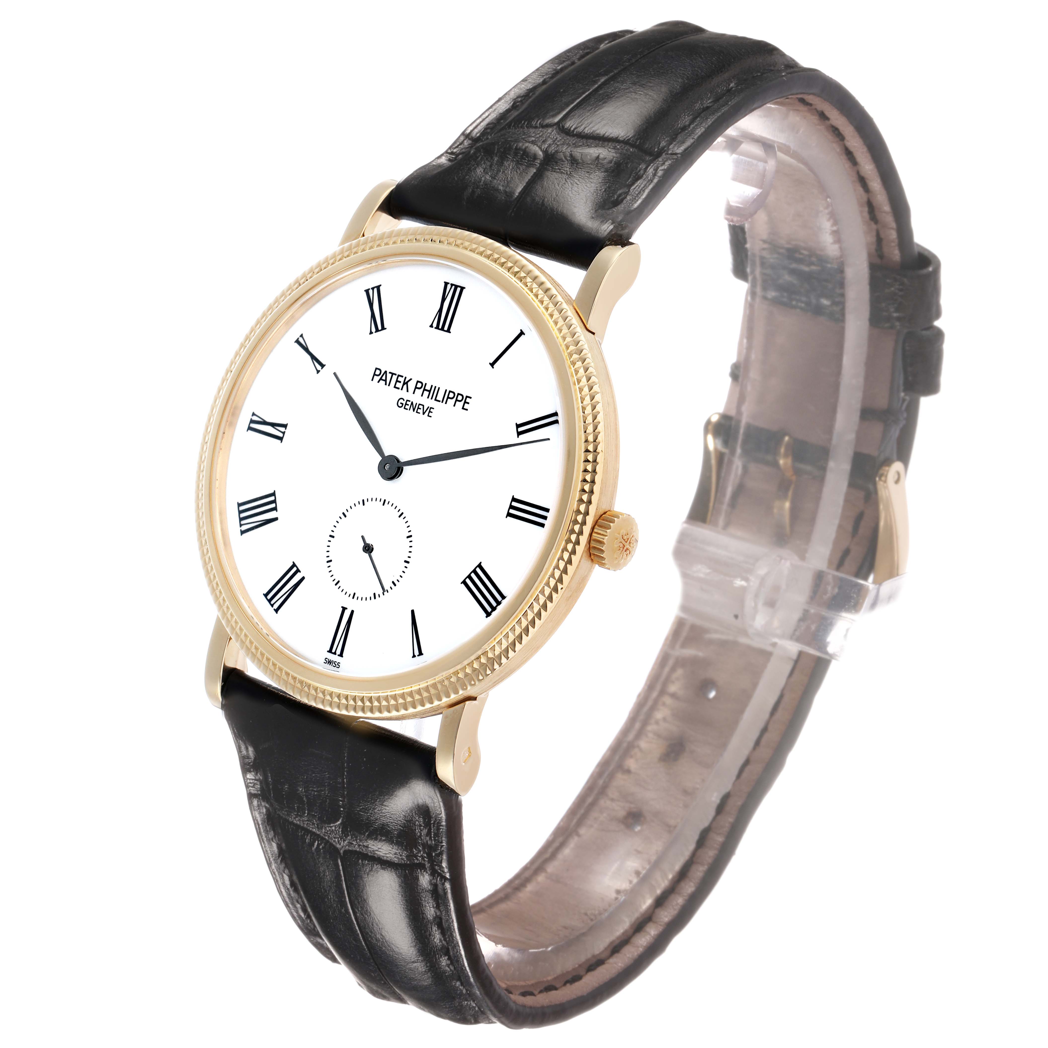 The Patek Philippe Calatrava 5119J Men's Yellow Gold White Dial watch is shown at a slight angle, highlighting the face, hands, Roman numerals, bezel, and leather strap.