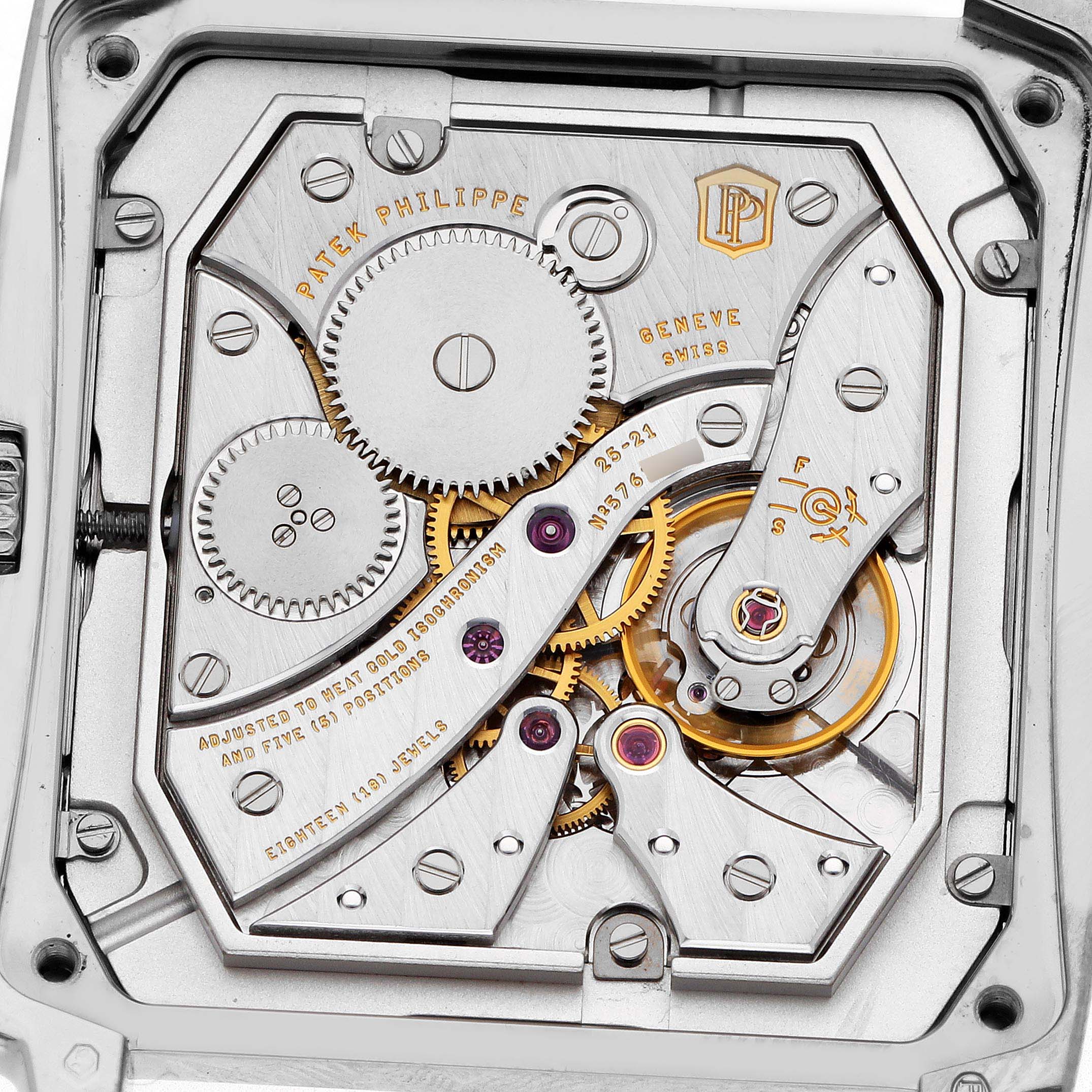 The image shows the intricate movement of the Patek Philippe Gondolo 5124G Men's White Gold Pink Dial watch from a top-down angle, revealing gears and mechanical parts.