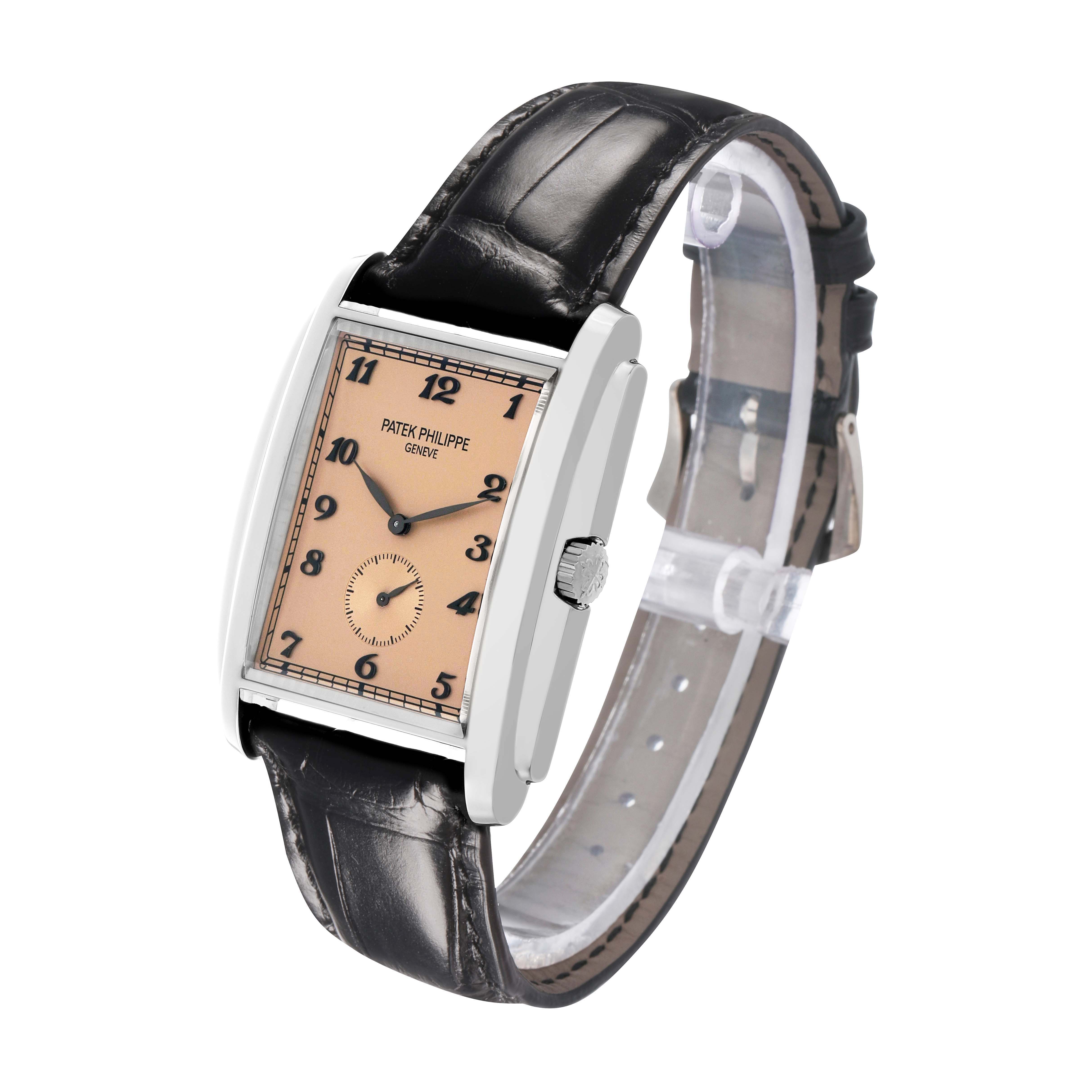 The Patek Philippe Gondolo 5124G Men's White Gold Pink Dial watch is shown at a three-quarter angle, highlighting its rectangular dial, crown, and leather strap.