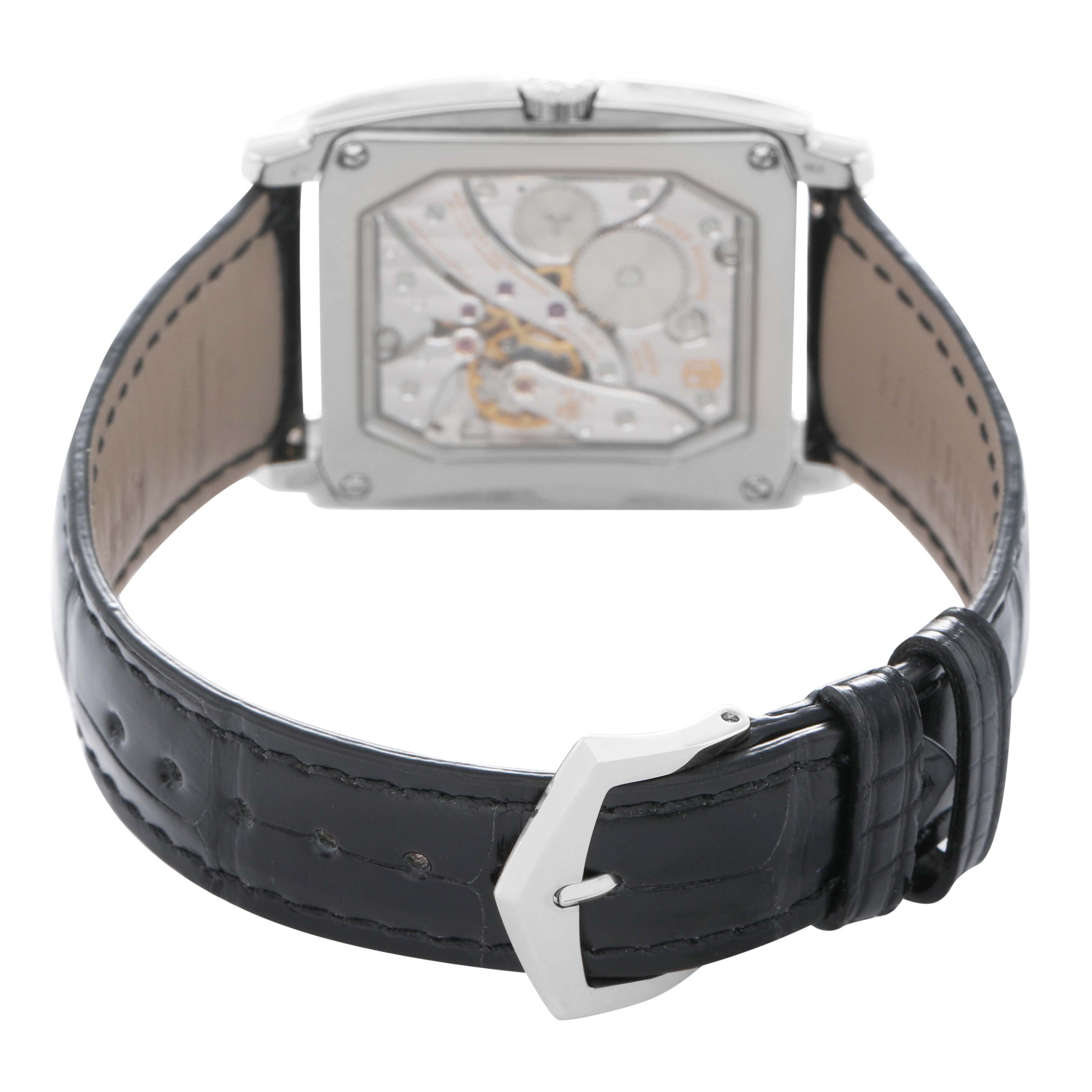 The image shows the back of the Patek Philippe Gondolo 5124G Men's White Gold Pink Dial watch, highlighting its movement and black leather strap with a buckle.