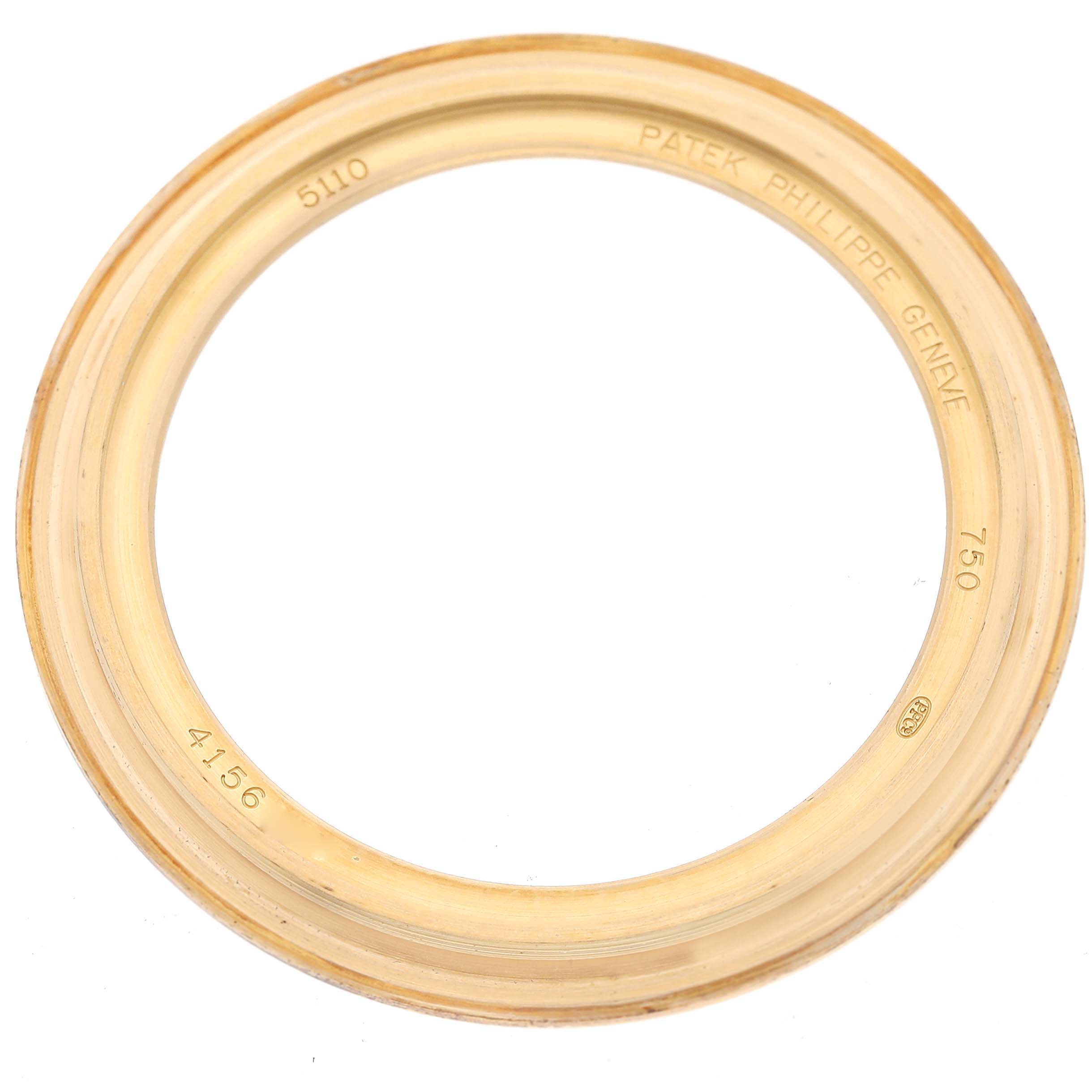 This image shows the bezel of a Patek Philippe Complications 5110J Men's Yellow Gold Silver Dial 5110J Men's Yellow Gold Silver Dial model watch.