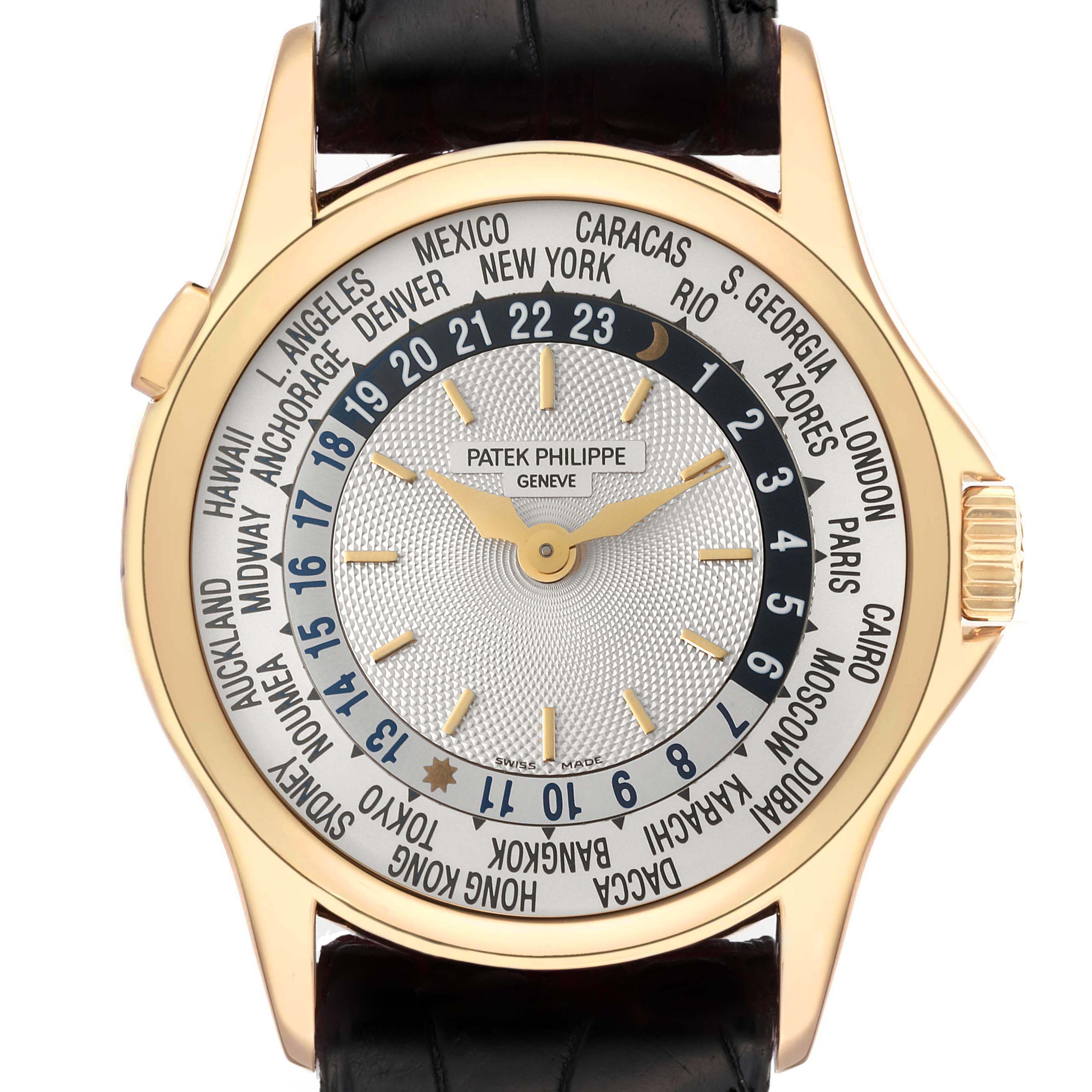 The image shows a front view of the Patek Philippe Complications 5110J Men's Yellow Gold Silver Dial 5110J Men's Yellow Gold Silver Dial watch, displaying the world time zones and city names.
