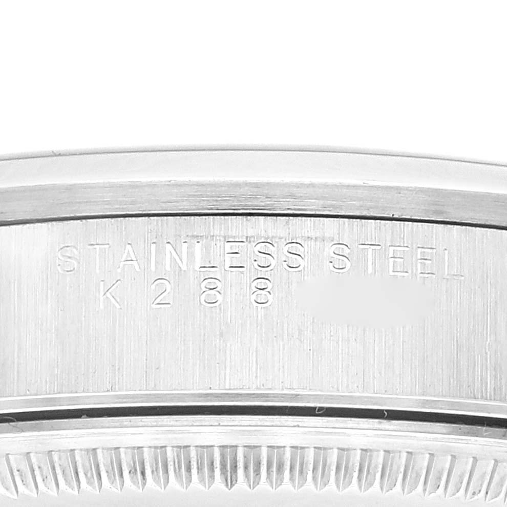 The image shows a close-up side view of the stainless steel casing of a Rolex Air-King 14000 Men's Stainless Steel Blue Dial 14000 Men's Stainless Steel Blue Dial watch, highlighting serial number details.