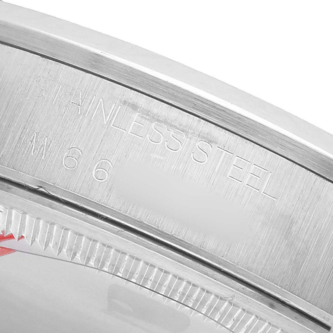 The image shows a close-up angle of the stainless steel case back edge of a Rolex Air-King 14000 Men's Stainless Steel Pink Dial watch.