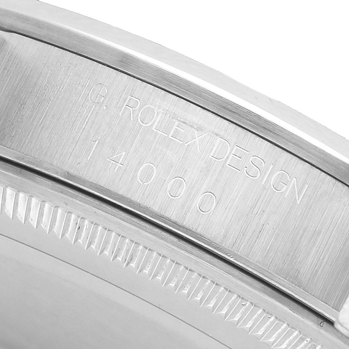 This image shows a close-up of the side engraving on the case of a Rolex Air-King 14000 Men's Stainless Steel Pink Dial, displaying the model number.