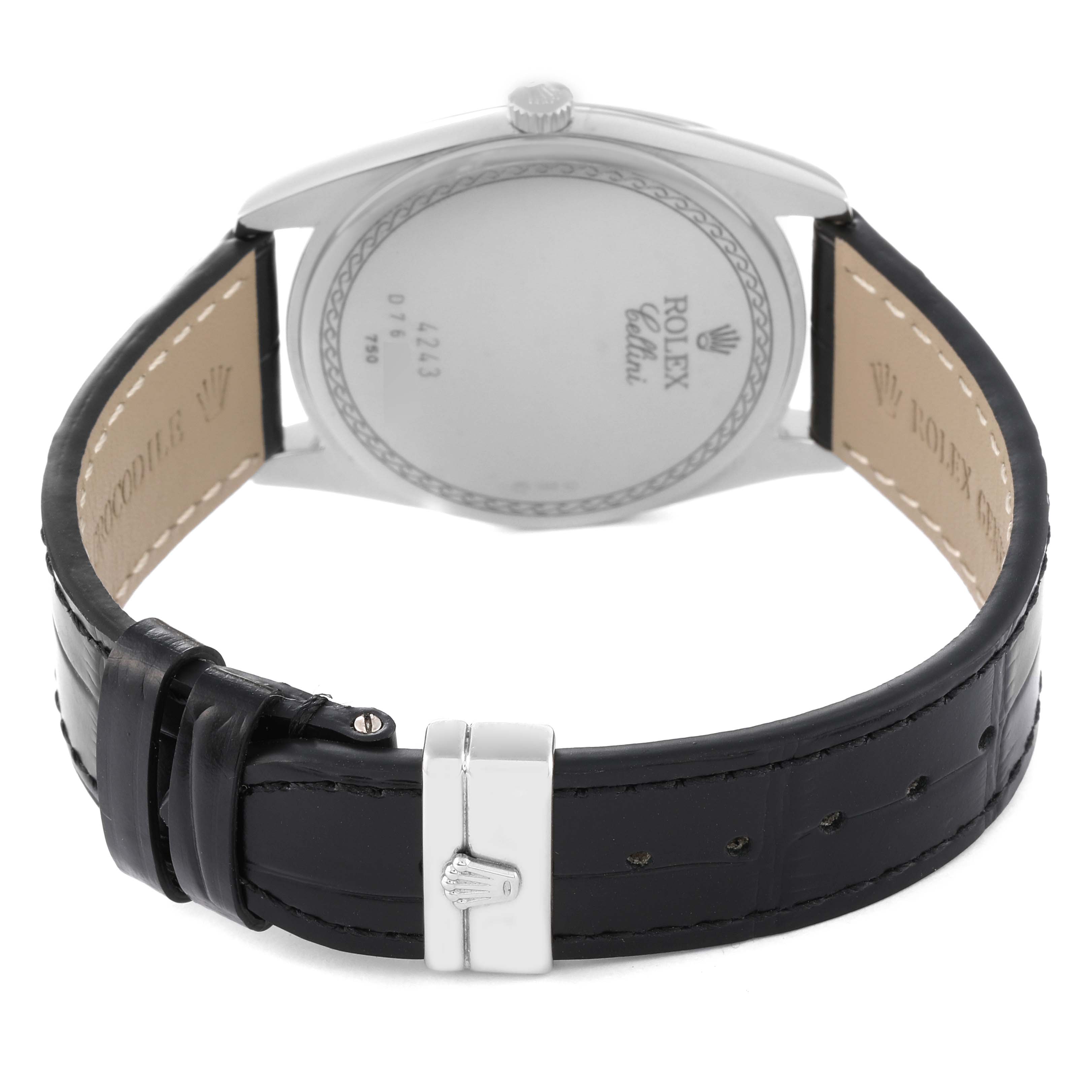 The image shows the back and strap of a Rolex Cellini 4243/9 Men
s White Gold Silver Dial 4243/9 Men
s White Gold Silver Dial watch, highlighting its clasp and inscription.