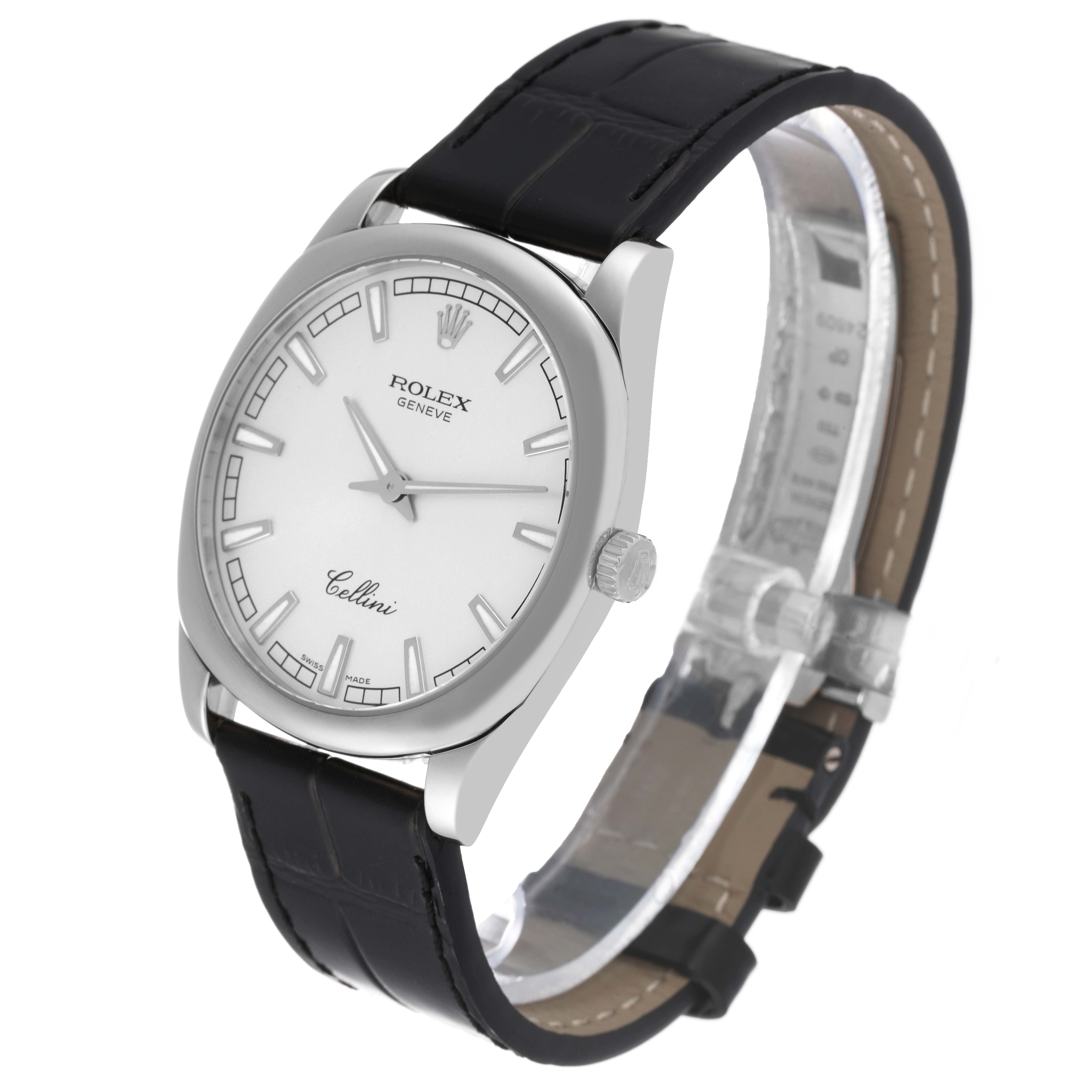 The image showcases a Rolex Cellini 4243/9 Men
s White Gold Silver Dial 4243/9 Men
s White Gold Silver Dial watch at an angled view, highlighting the dial, case, crown, and leather strap.