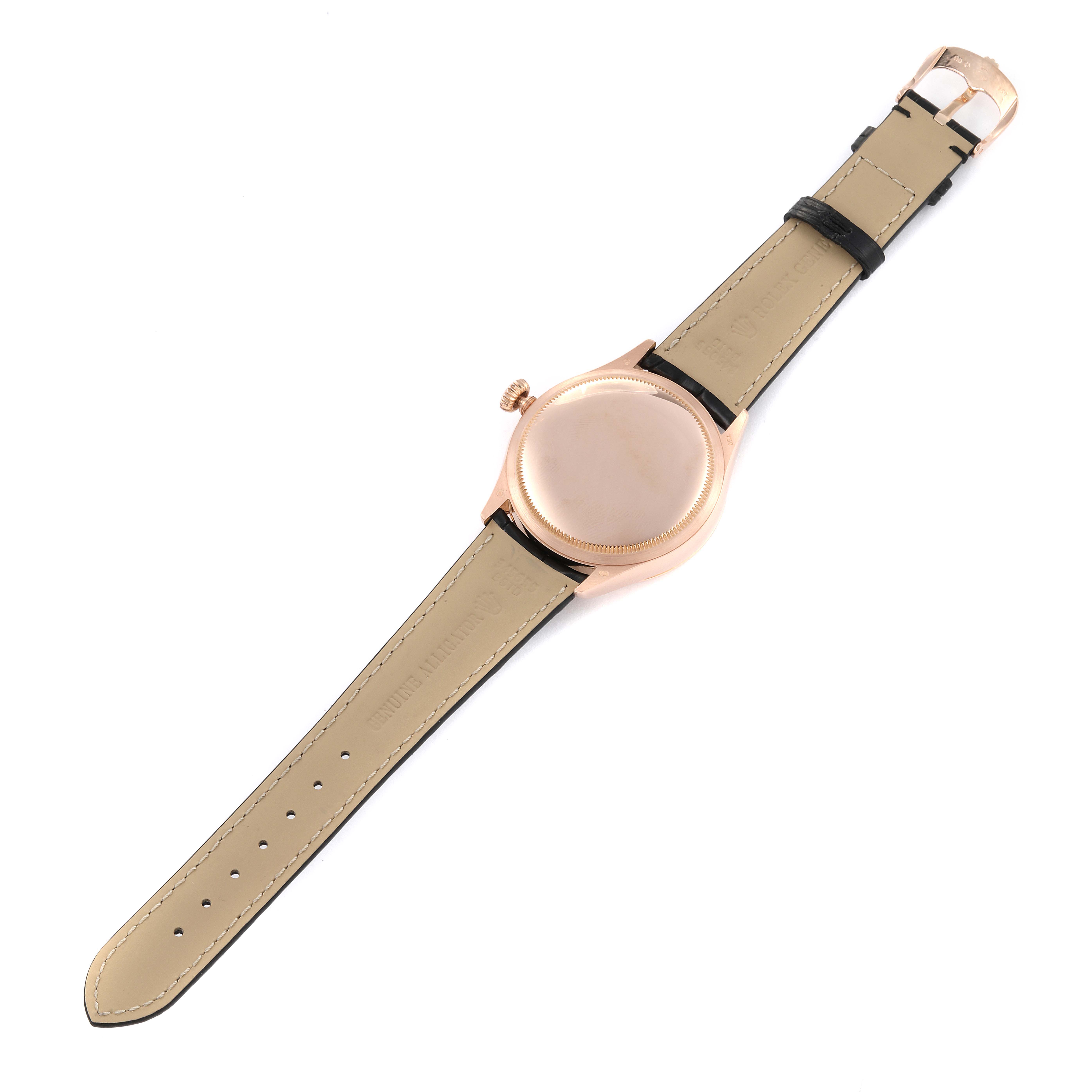 The Rolex Cellini 50525 Men's Rose Gold Silver Dial 50525 Men's Rose Gold Silver Dial watch is shown from the back, displaying its leather strap and case back.