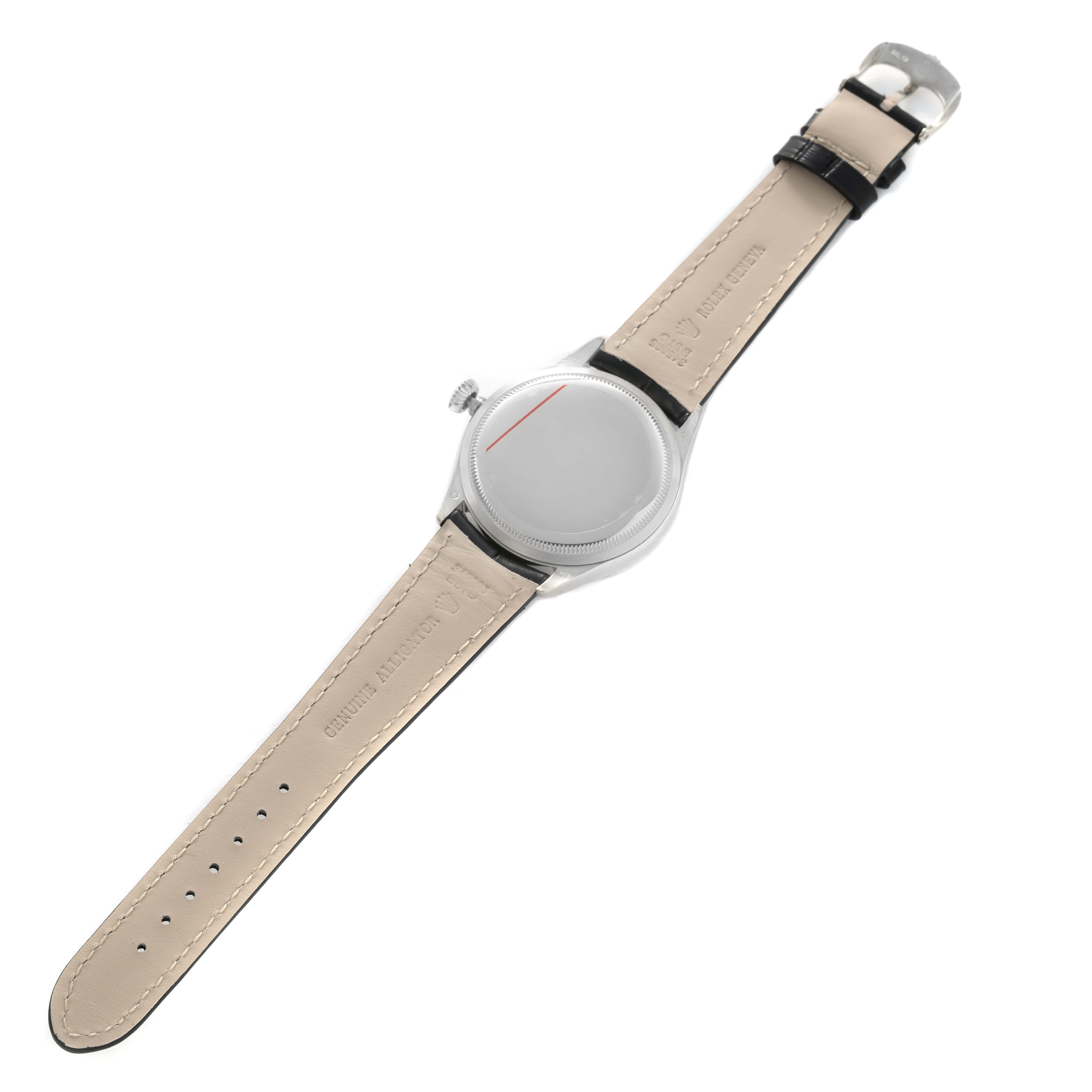 The image shows a Rolex Cellini 50709 Men's White Gold Silver Dial watch from the back, highlighting the case back, crown, and leather strap with the clasp.