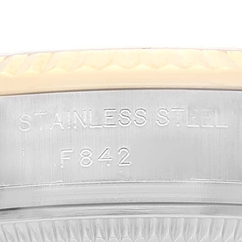 The image shows a close-up of the side of a Rolex Datejust 179173 Women's Steel and Gold (two tone) Silver Dial 179173 Women's Steel and Gold (two tone) Silver Dial watch case, highlighting the stainless steel material and reference engraving.