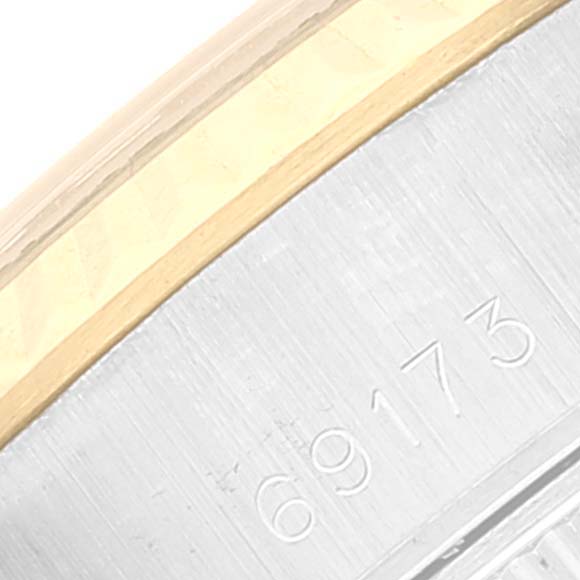 This close-up image shows the side engraving with model number "69173" on the case of a Rolex Datejust 69173 Women's Steel and Gold (two tone) Blue Dial 69173 Women's Steel and Gold (two tone) Blue Dial watch.