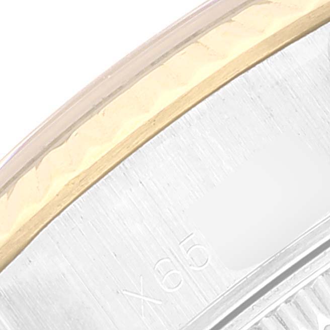 This close-up image shows the bezel and part of the case side of a Rolex Datejust 69173 Women's Steel and Gold (two tone) Blue Dial 69173 Women's Steel and Gold (two tone) Blue Dial watch.