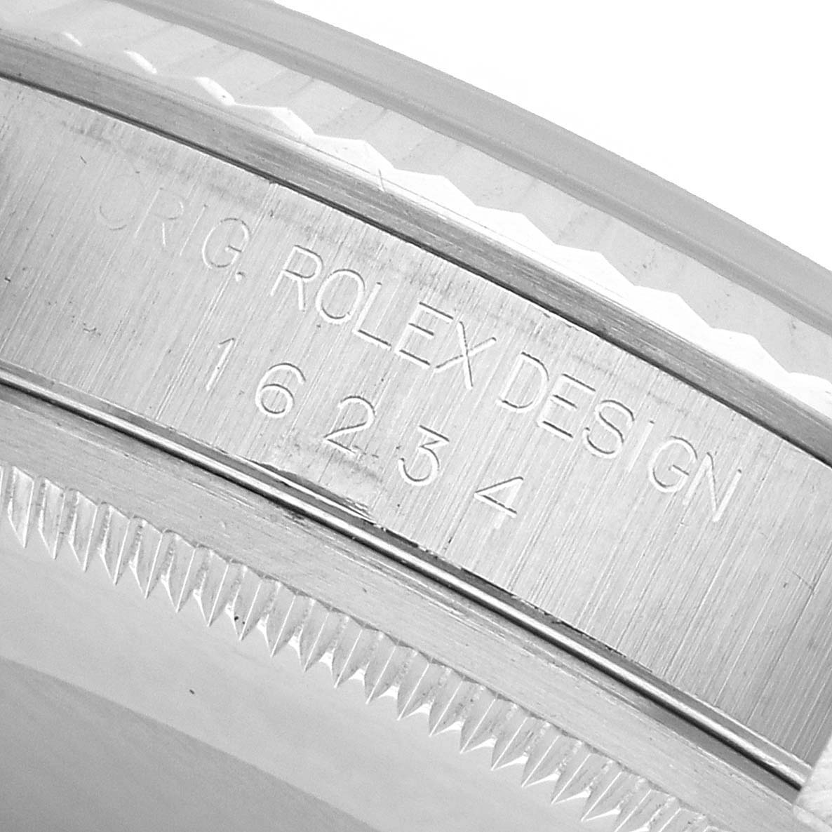 The image shows a close-up of the Rolex Datejust 16234 Men's Stainless Steel Pink Dial's case side with the engraved model number.