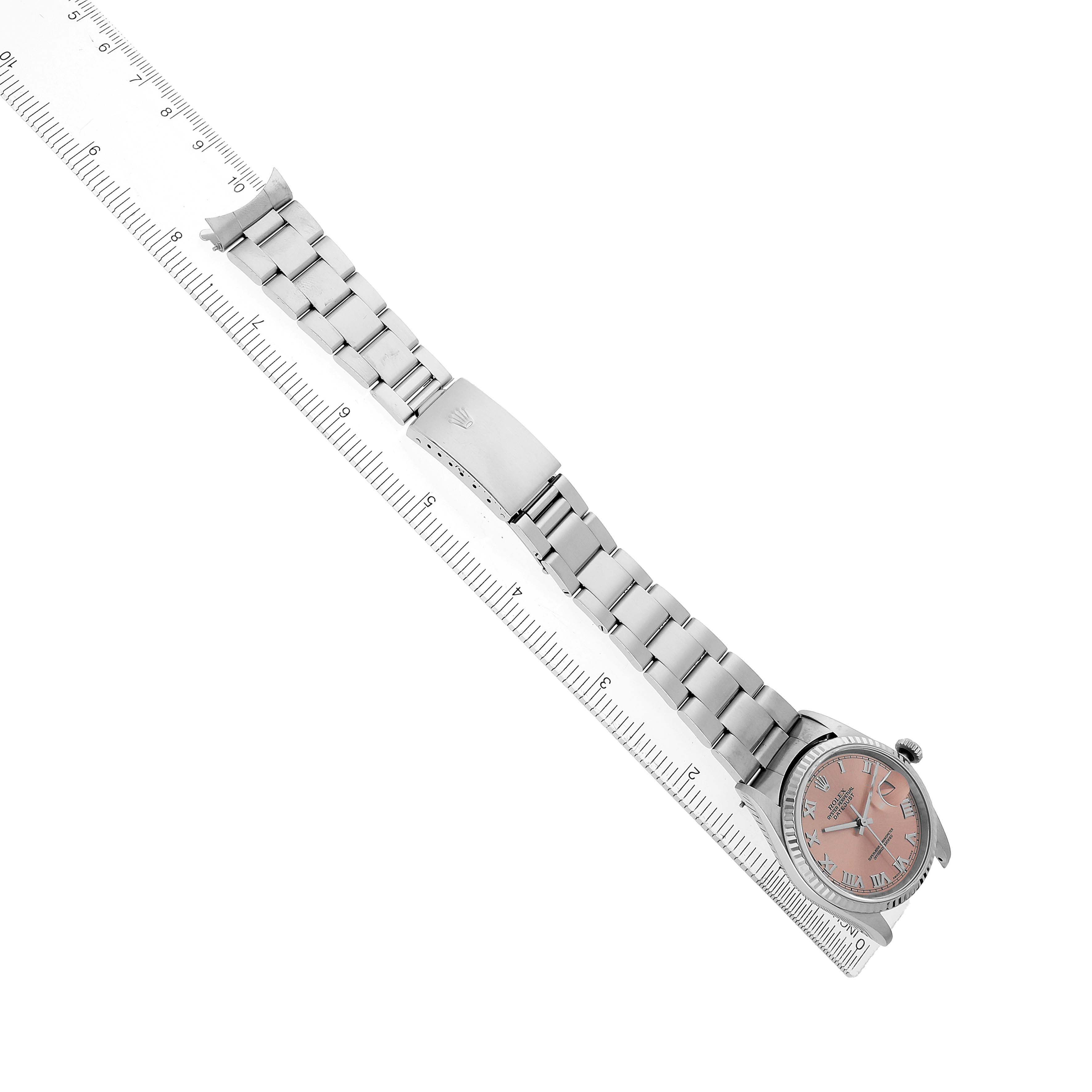 The Rolex Datejust 16234 Men's Stainless Steel Pink Dial watch is shown from a top-down angle, highlighting its full bracelet, clasp, and face.