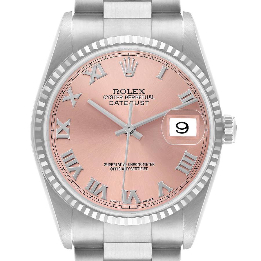 The image shows a Rolex Datejust 16234 Men's Stainless Steel Pink Dial watch from a front angle, highlighting the pink dial, Roman numerals, date window, and fluted bezel.