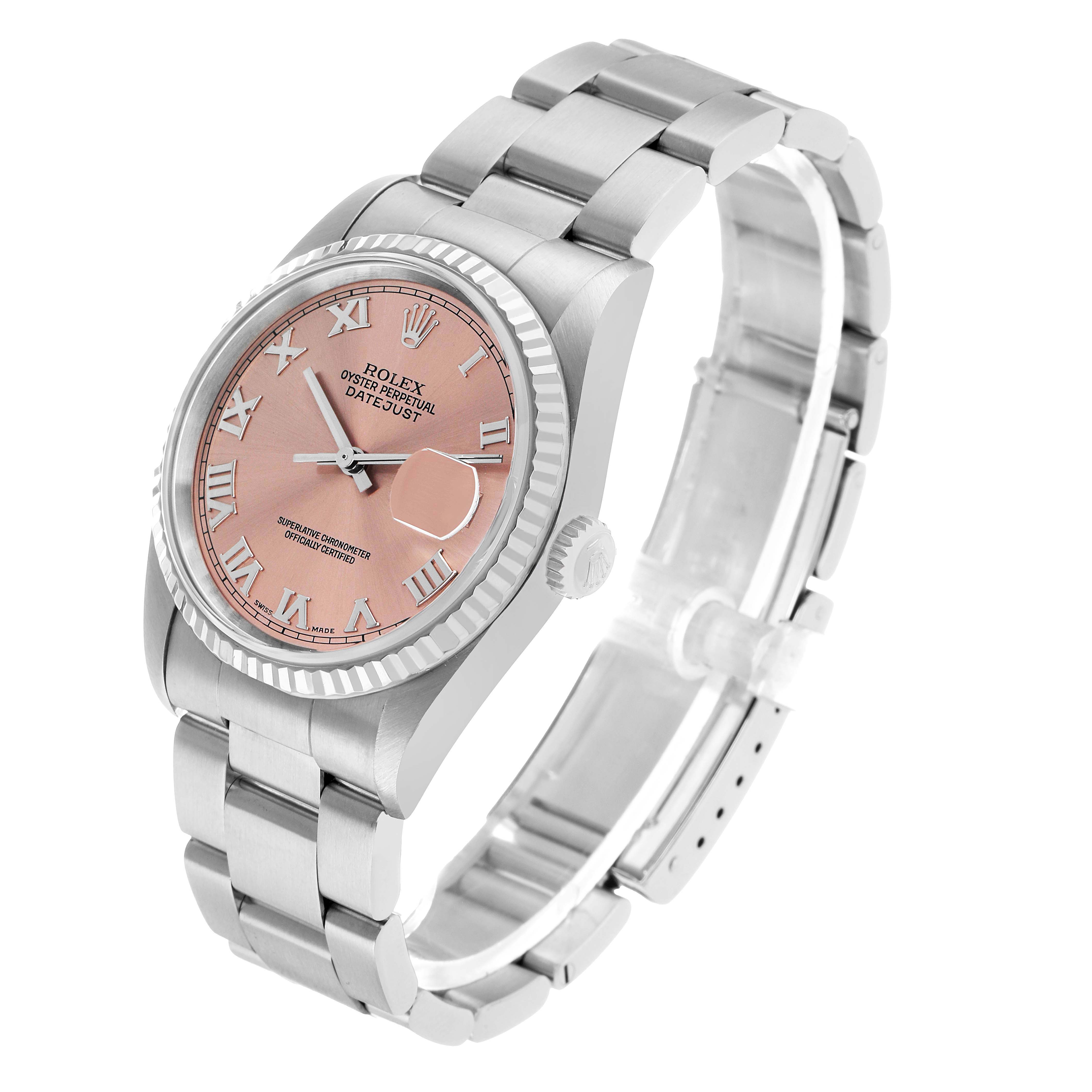 The Rolex Datejust 16234 Men's Stainless Steel Pink Dial watch is shown from a three-quarter angle, displaying the dial, fluted bezel, bracelet, and crown.