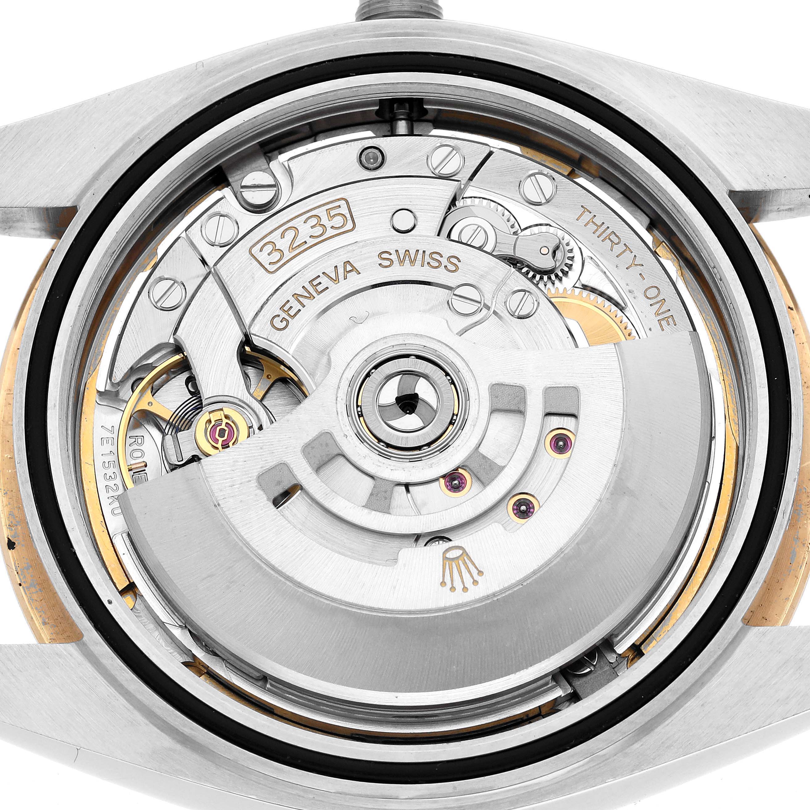 The image shows the movement of a Rolex Datejust 41 126333 Men's Steel and Gold (two tone) Champagne Dial, focusing on the rotor and internal mechanism parts from the back.