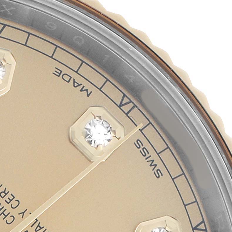 The image shows a close-up of the Rolex Datejust 41 126333 Men's Steel and Gold (two tone) Champagne Dial's dial, focusing on diamond hour markers, minute track, and part of the bezel.