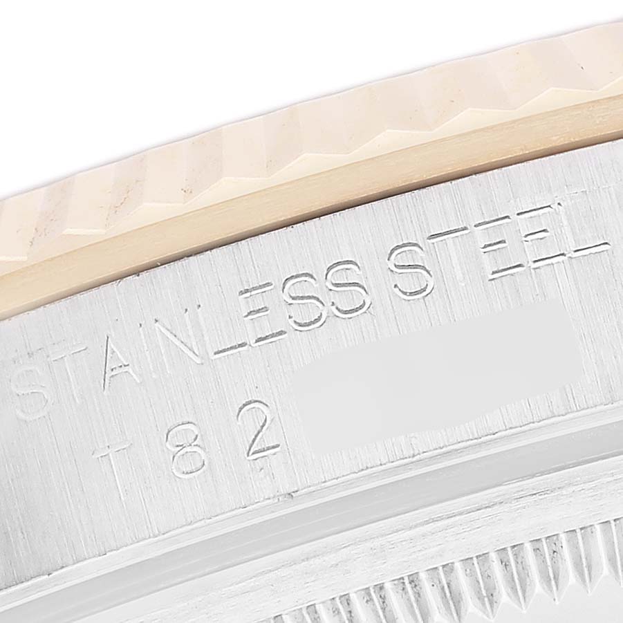 The image shows a close-up view of the stainless steel case and fluted bezel of the Rolex Datejust 16233 Men's Steel and Gold (two tone) Champagne Dial 16233 Men's Steel and Gold (two tone) Champagne Dial watch.