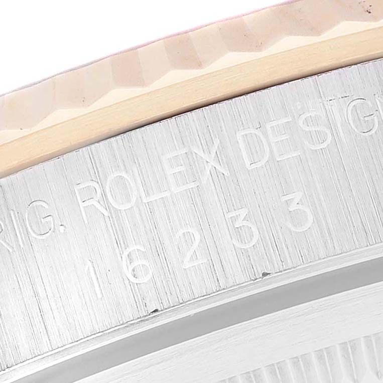 This image shows a close-up of the engraved serial and model numbers on the case side of a Rolex Datejust 16233 Men's Steel and Gold (two tone) Champagne Dial 16233 Men's Steel and Gold (two tone) Champagne Dial watch.