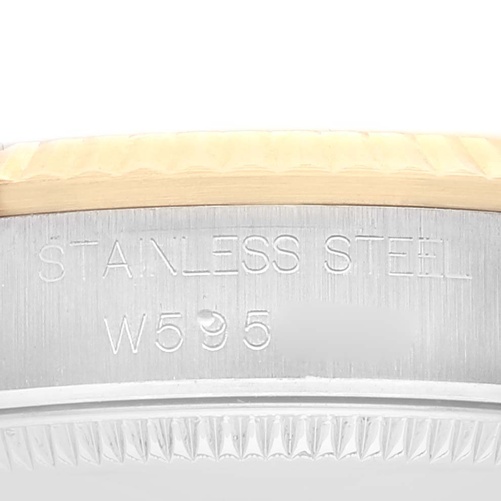 This image shows a close-up of the side engravings on a stainless steel Rolex Mid-Size 68273 Women
s Steel and Gold (two tone) Champagne Dial 68273 Women
s Steel and Gold (two tone) Champagne Dial model.