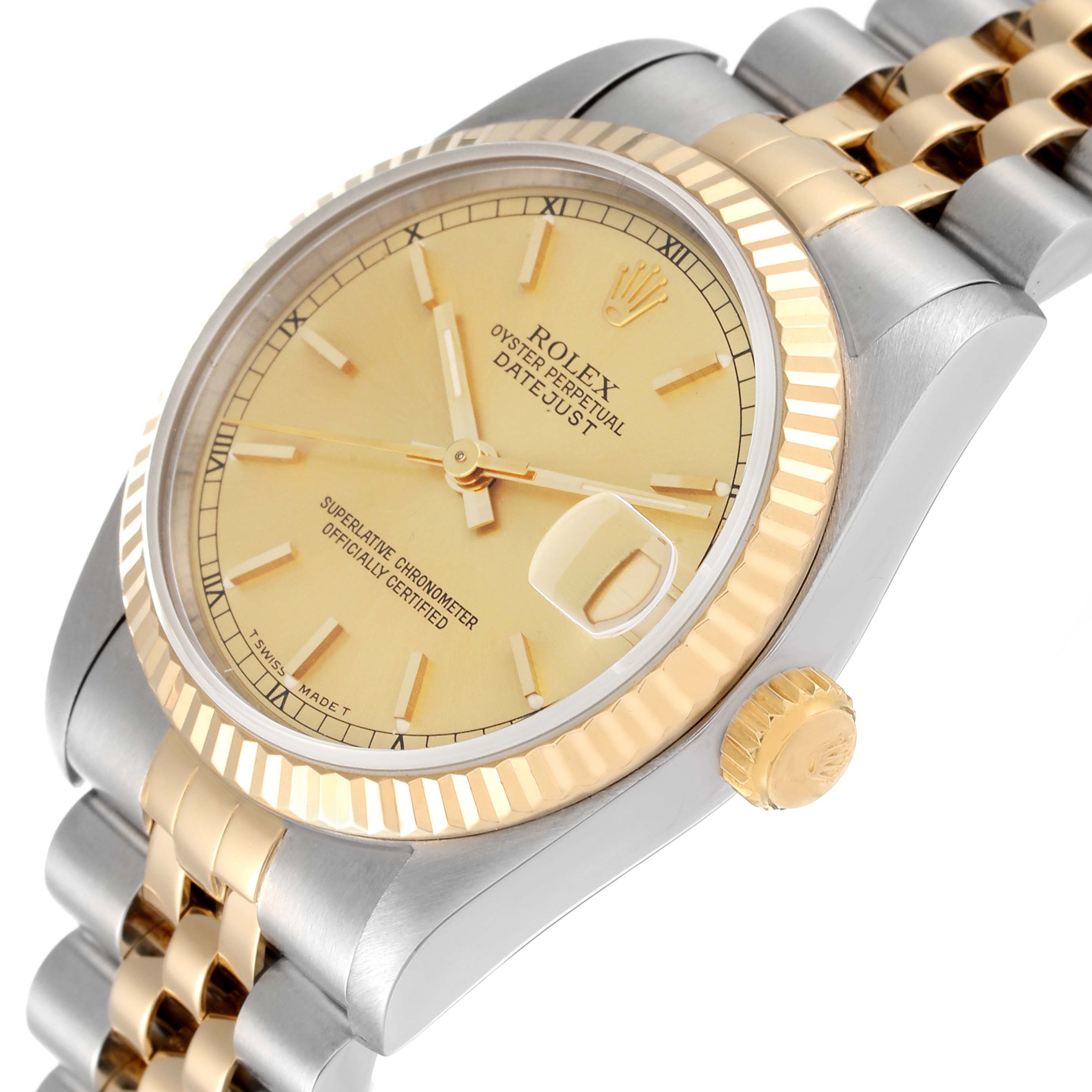 The image shows a close-up side angle of a Rolex Mid-Size 68273 Women
s Steel and Gold (two tone) Champagne Dial 68273 Women
s Steel and Gold (two tone) Champagne Dial Datejust watch, featuring its dial, bezel, crown, and part of the bracelet.