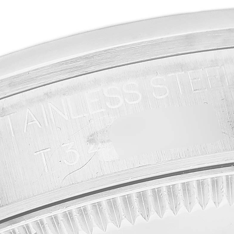 This image shows a close-up view of the engraved case back of a Rolex Mid-Size 68240 Women
s Stainless Steel White Dial 68240 Women
s Stainless Steel White Dial model watch.
