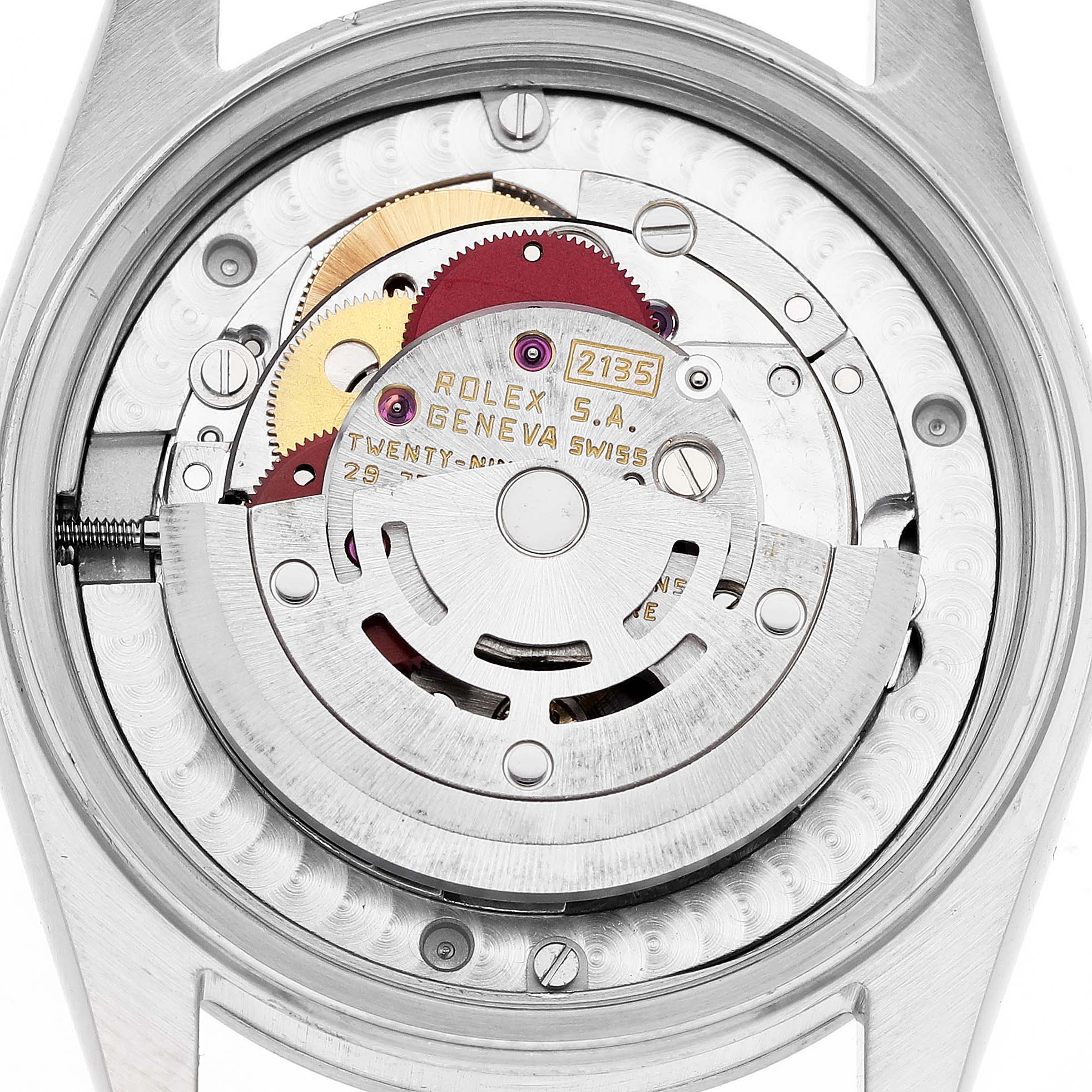 This image shows the back view of a Mid-Size Rolex watch, displaying its intricate internal mechanism.