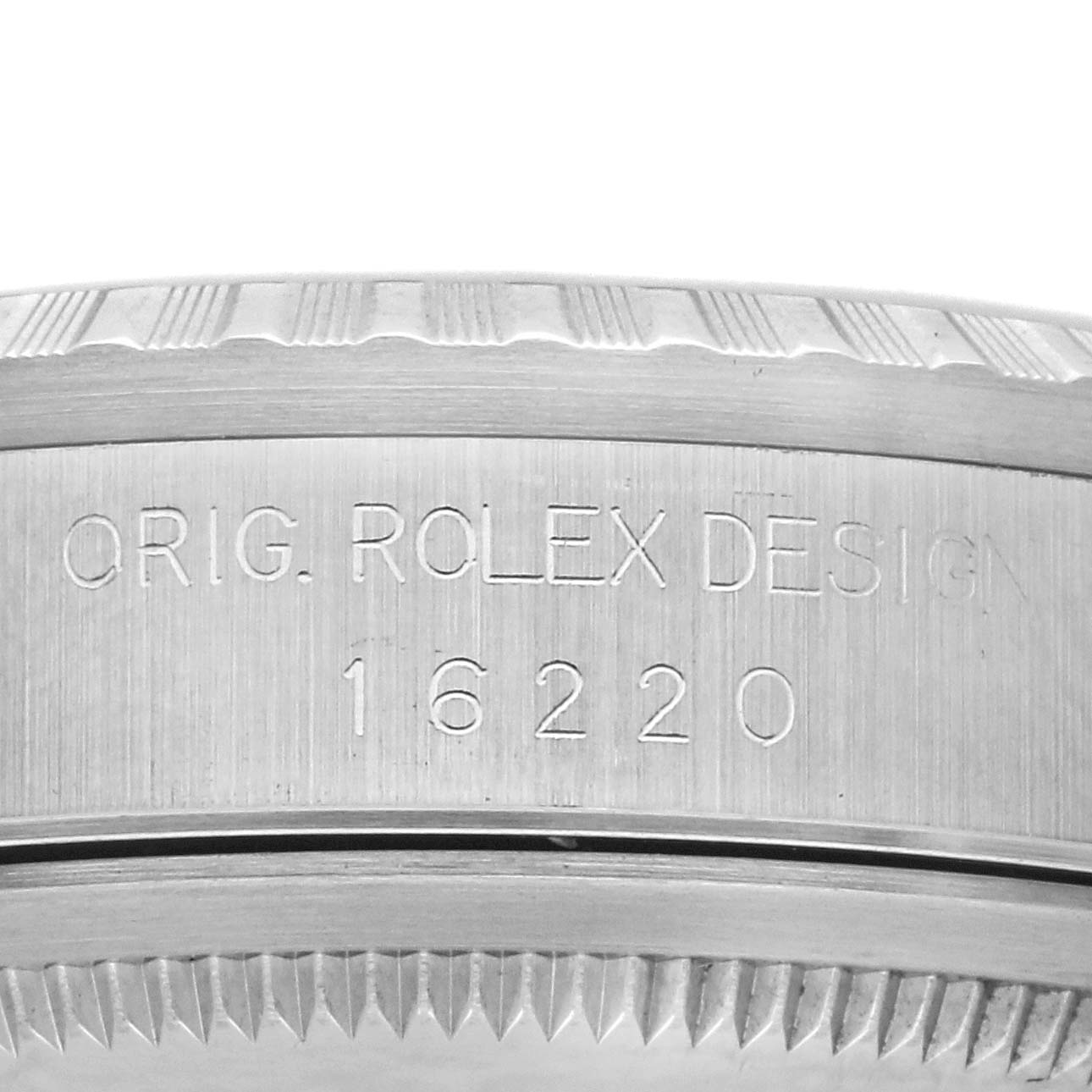 The image shows a close-up side view of the case side, engraving, and edge of the bezel of a Rolex Datejust 16220 Men's Stainless Steel Silver Dial 16220 Men's Stainless Steel Silver Dial watch.