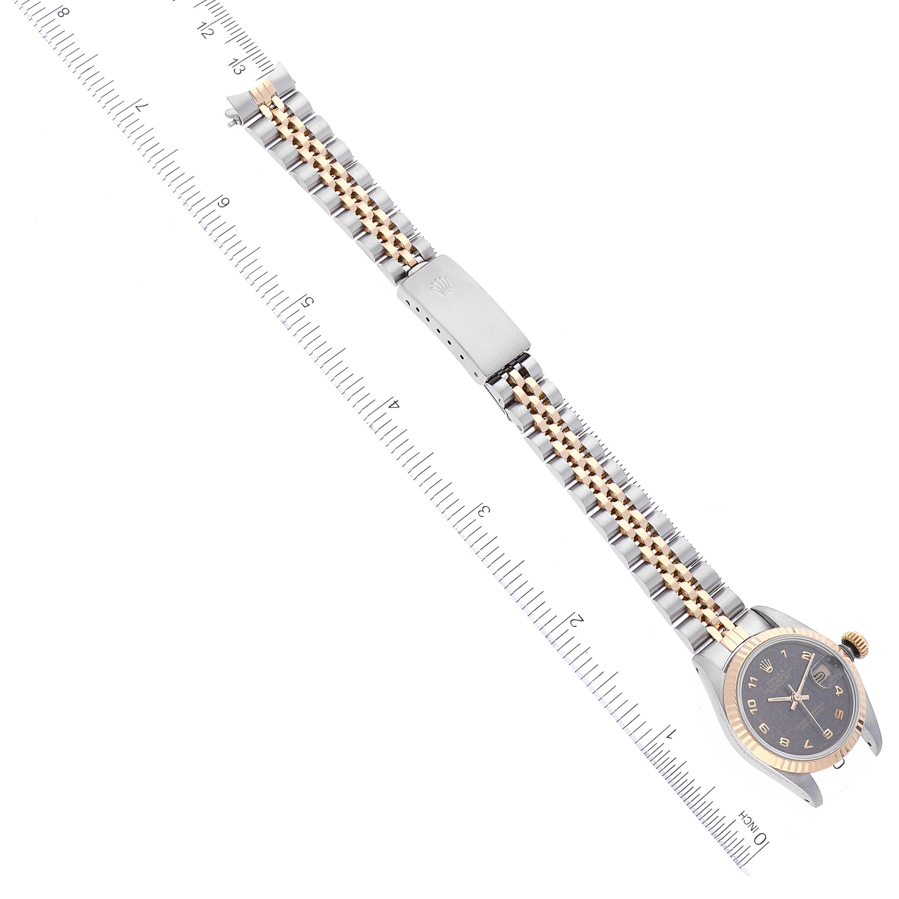 The image shows a Rolex Datejust 69173 Women
s Steel and Gold (two tone) Grey Dial 69173 Women
s Steel and Gold (two tone) Grey Dial watch laid flat, displaying the bracelet, clasp, and dial, with a ruler along the side.