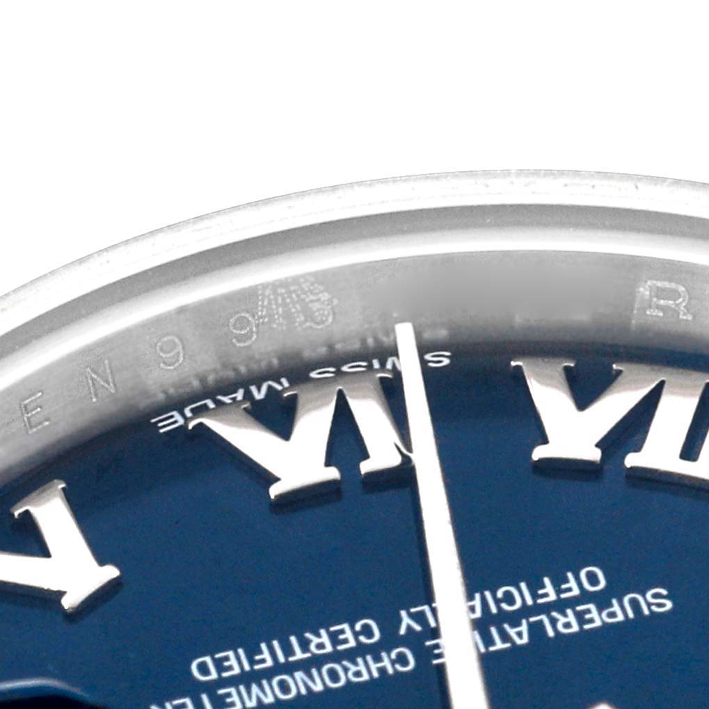 This image shows a close-up angle of the dial and rehaut of a Rolex Datejust 179174 Women's Stainless Steel Blue Dial 179174 Women's Stainless Steel Blue Dial watch, highlighting the Roman numerals and "Swiss Made" text.