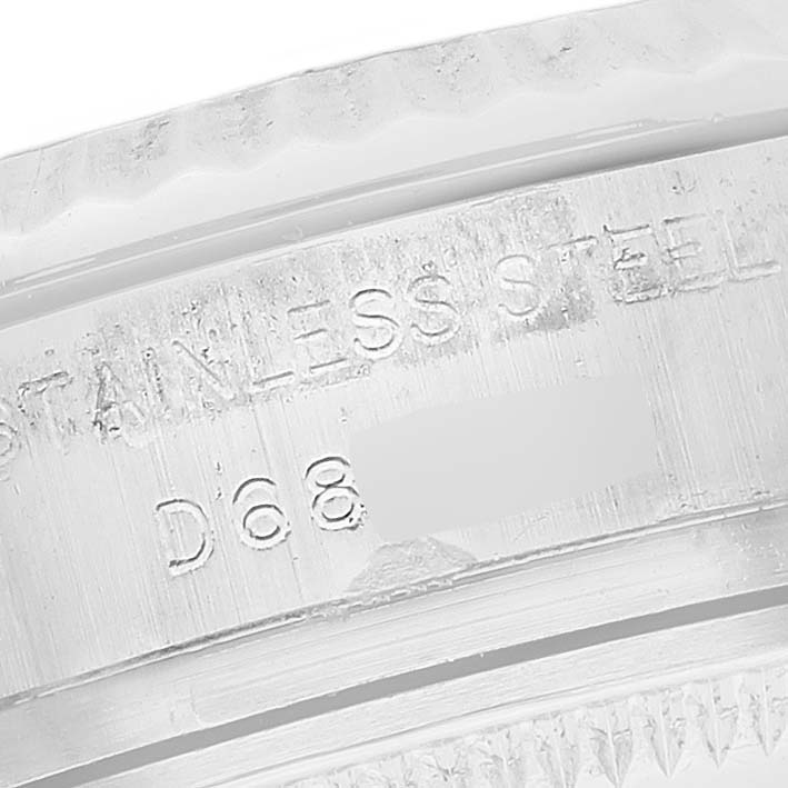 This is a close-up of the engraving on the stainless steel bezel or interior of a Rolex Datejust 179174 Women's Stainless Steel Silver Dial 179174 Women's Stainless Steel Silver Dial watch.