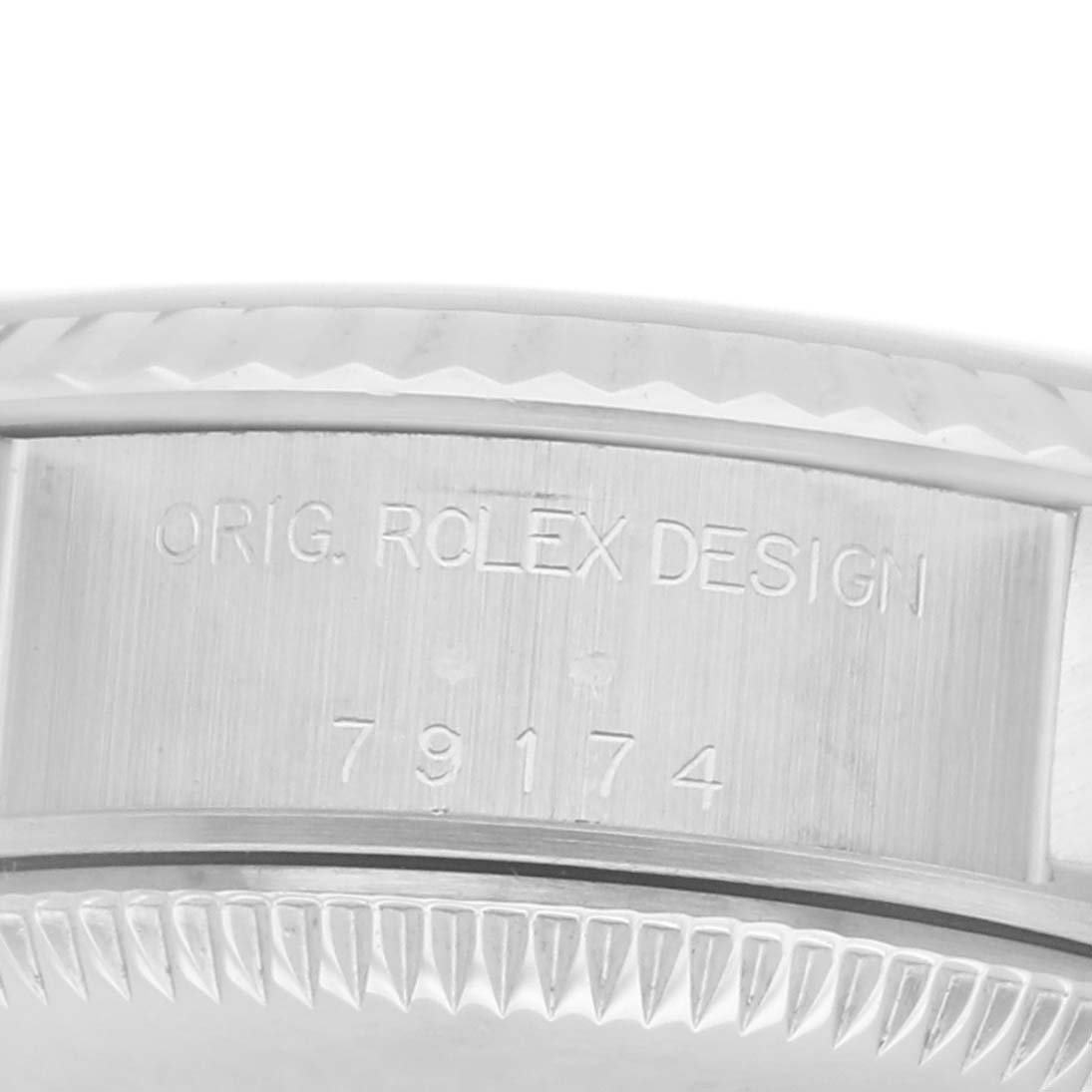 The image shows a close-up of the side case with the engraved model number of the Rolex Datejust 79174 Women's Stainless Steel Pink Dial watch.